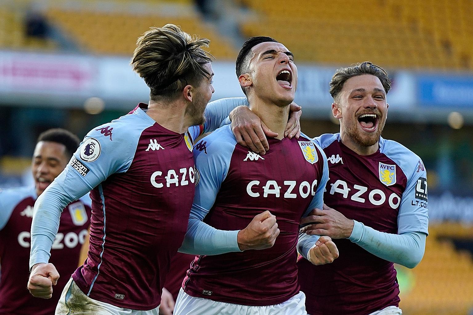 Aston Villa's Dutch forward Anwar El Ghazi (centre) is ecstatic after scoring late from the penalty spot to give them a 1-0 victory over Wolves. PHOTO: AGENCE FRANCE-PRESSE