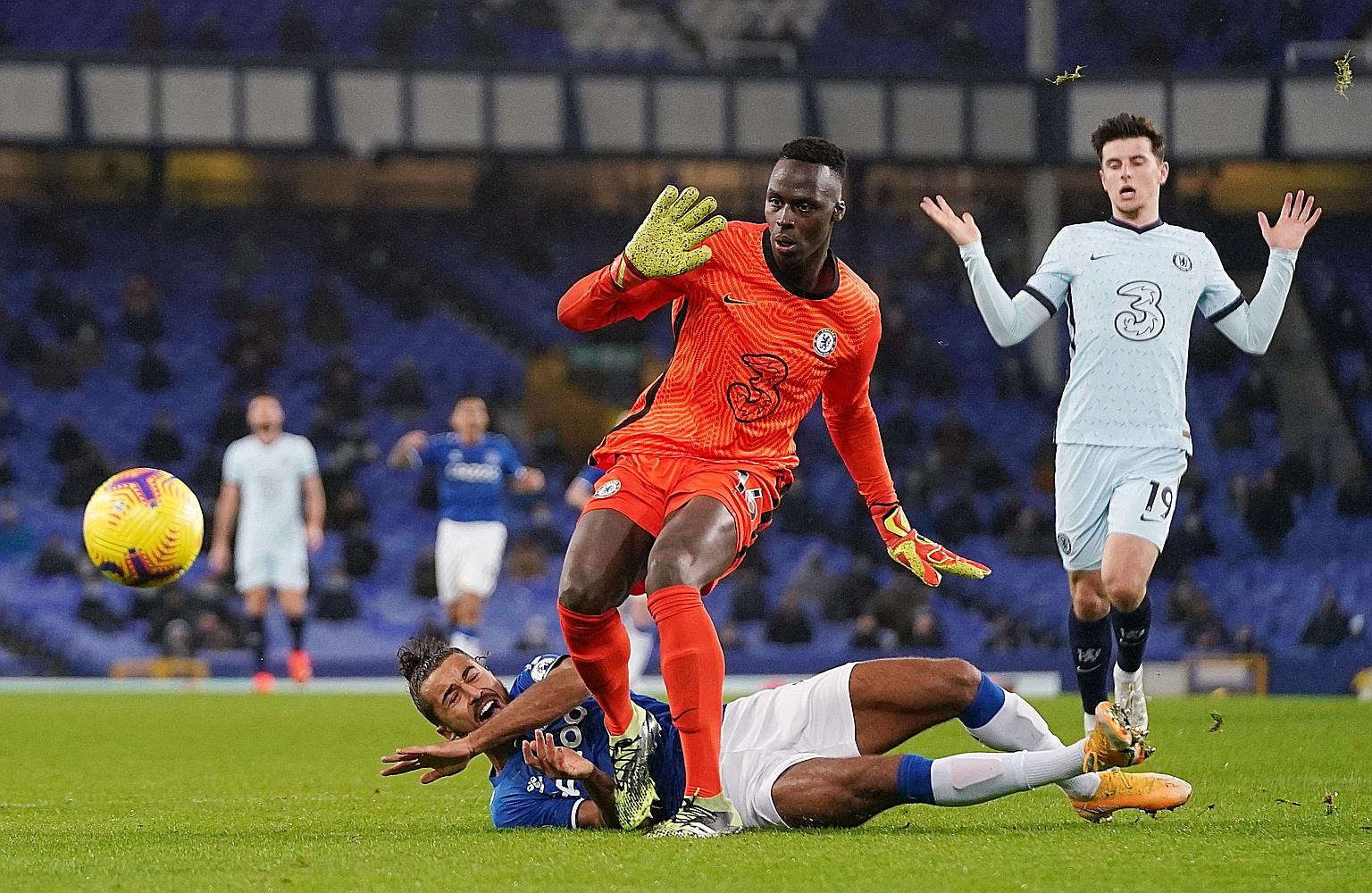Chelsea goalkeeper Edouard Mendy fouling Everton's Dominic Calvert-Lewin in the box. Iceland midfielder Gylfi Sigurdsson converted the penalty for his second goal of the season.