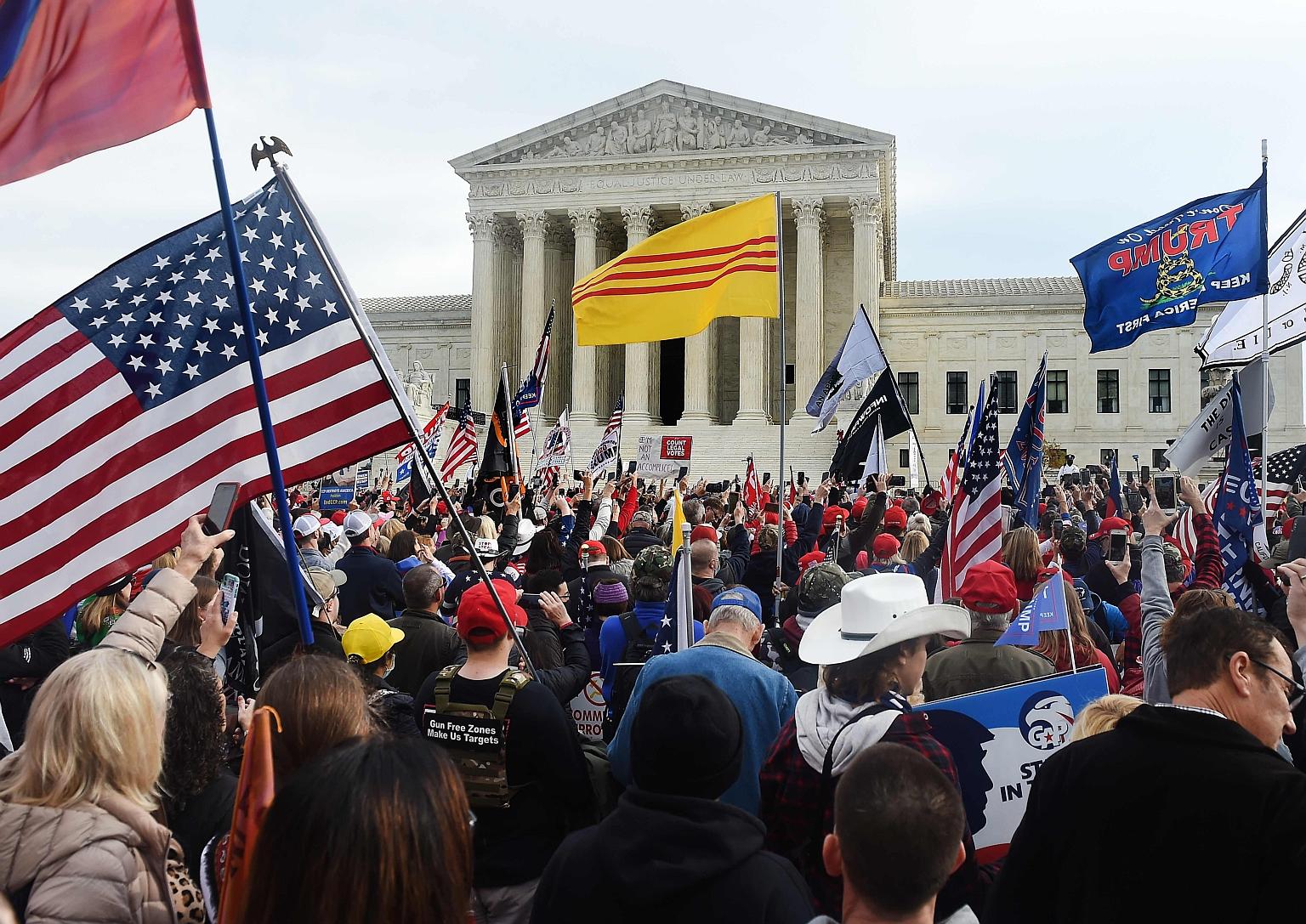Supporters of President Donald Trump protesting in front of the US Supreme Court in Washington on Saturday against the outcome of the Nov 3 election. State and federal courts have rejected dozens of lawsuits by Mr Trump's allies seeking to challenge