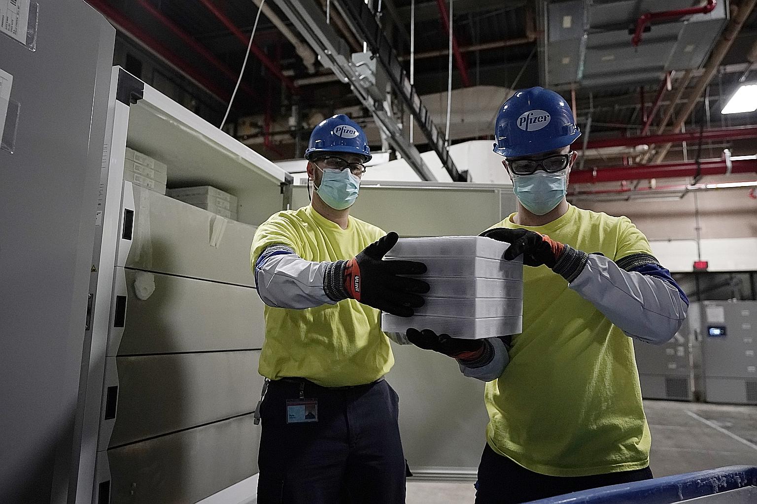 Workers preparing boxes containing the Pfizer-BioNTech Covid-19 vaccine for shipment at the Pfizer global supply facility in Kalamazoo, Michigan, in the United States, on Sunday. In Singapore, those who are at greatest risk will be given first priori