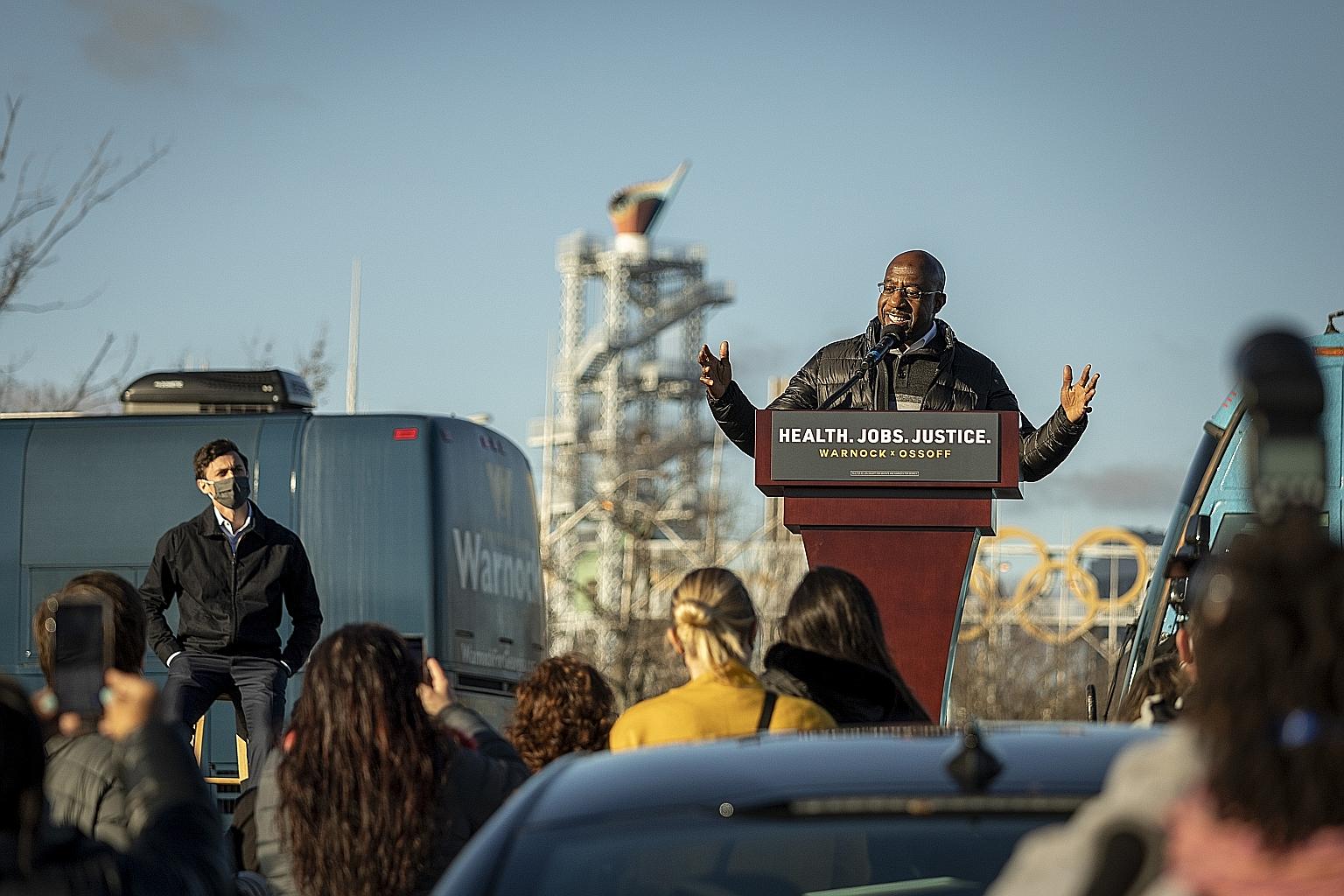 Georgia Democratic candidate Raphael Warnock speaking during a campaign event in Atlanta on Monday. Democrats face an uphill battle as they would need to win both Senate seats to control the chamber.