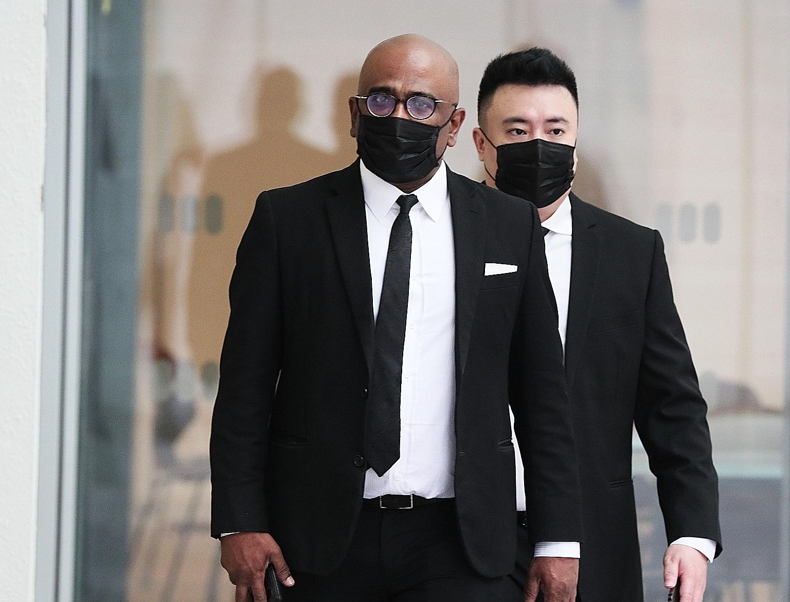 Lawyer M. Ravi arriving at the State Courts yesterday. He was charged with criminal defamation. ST PHOTO: KELVIN CHNG