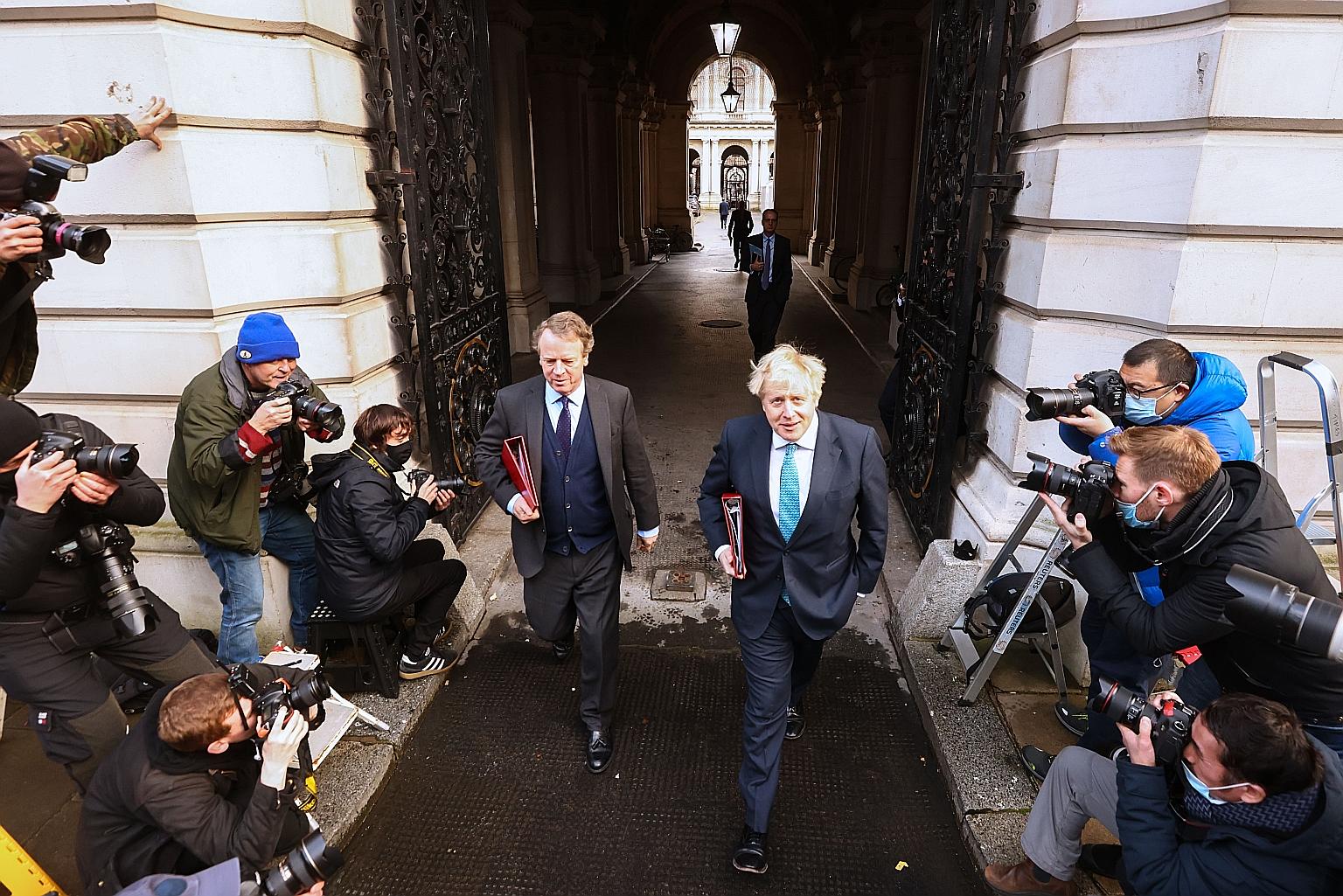 British Prime Minister Boris Johnson (right) leaving a Cabinet meeting in London on Tuesday, with Mr Alister Jack, Secretary of State for Scotland. Mr Johnson will be visiting India next month.