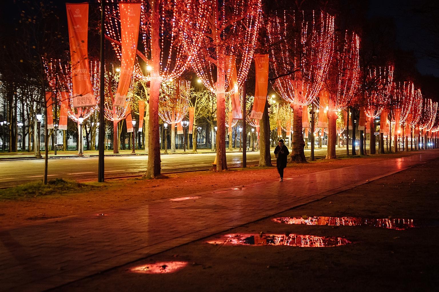 A pedestrian in the Champs Elysees in Paris on Tuesday, the day a new nightly curfew came into force in France with the aim of trying to prevent another spike in Covid-19 infections. From 8pm to 6am, people can go out only for work, on official busin