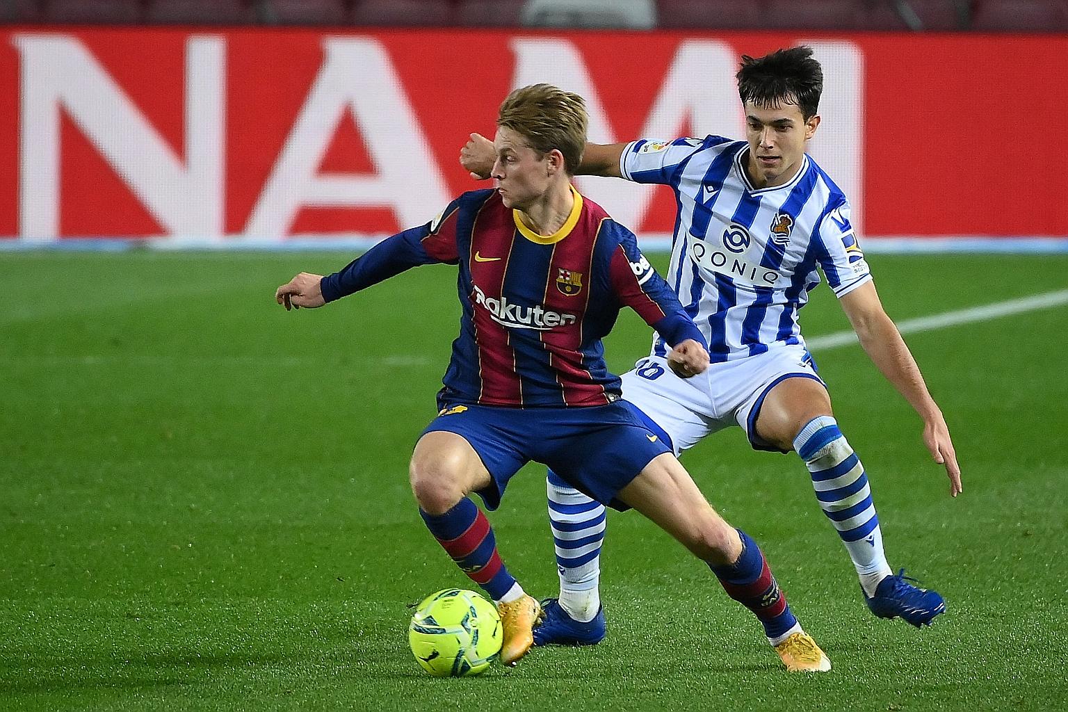 Barca midfielder Frenkie de Jong keeping the ball from his Sociedad counterpart Martin Zubimendi during the Catalans' 2-1 win.