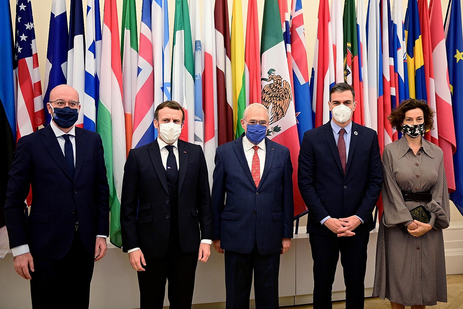 (From left) European Council President Charles Michel, French President Emmanuel Macron, OECD Secretary-General Angel Gurria and Spanish Premier Pedro Sanchez at the OECD event in Paris on Monday.