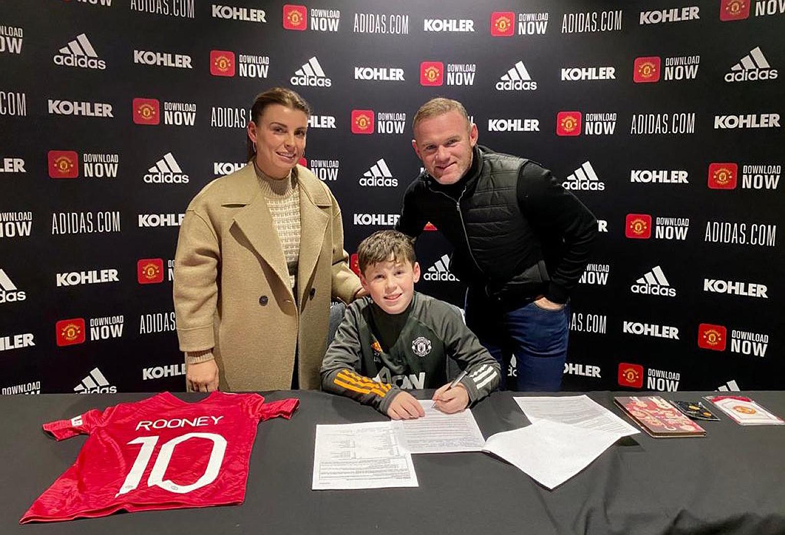 Wayne Rooney and wife Coleen at their eldest son Kai's signing ceremony for Manchester United on Thursday.