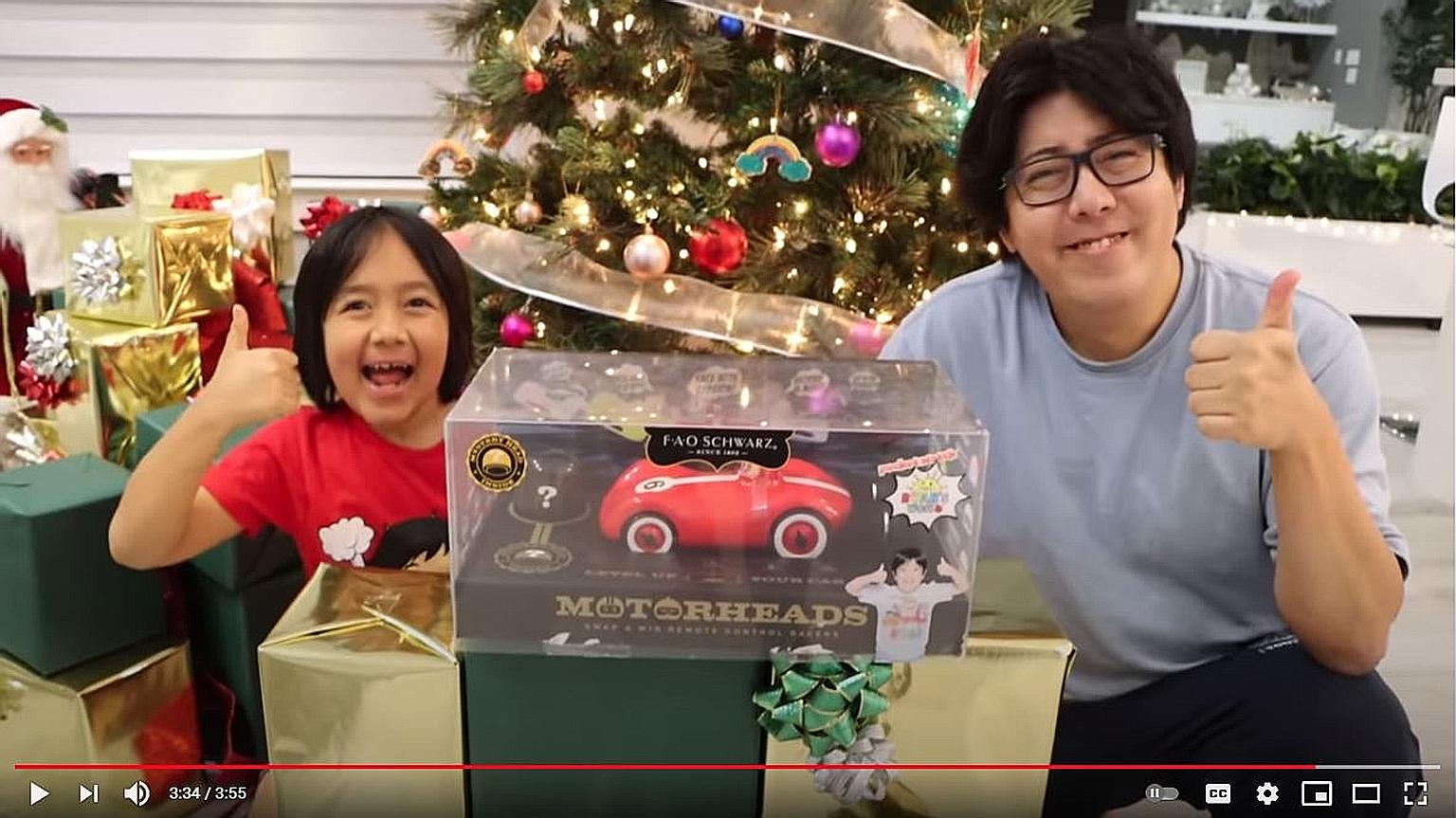 Child influencer Ryan Kaji, seen here with his father Shion Kaji, topped Forbes' annual list of highest-paid YouTubers for the third year running. The nine-year-old reviews toys and games on his channel, Ryan's World.