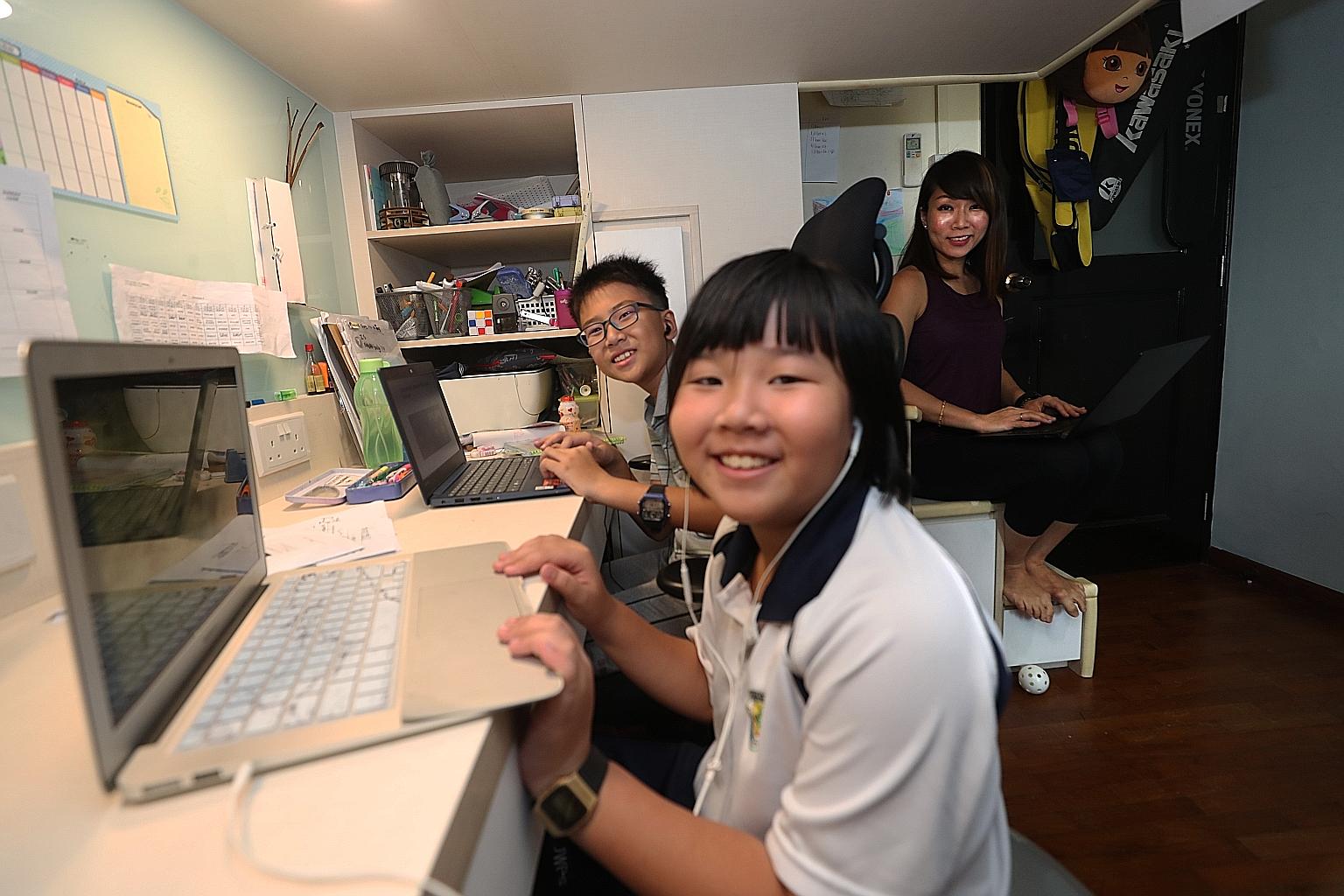 Ms Yvonne Kong-Ho did her work while keeping an eye on her children Gabriel and Natalie, who are in Primary 5 and 3 respectively, on their first day of home-based learning on April 8. Schools shifted online in Singapore earlier this year during the p