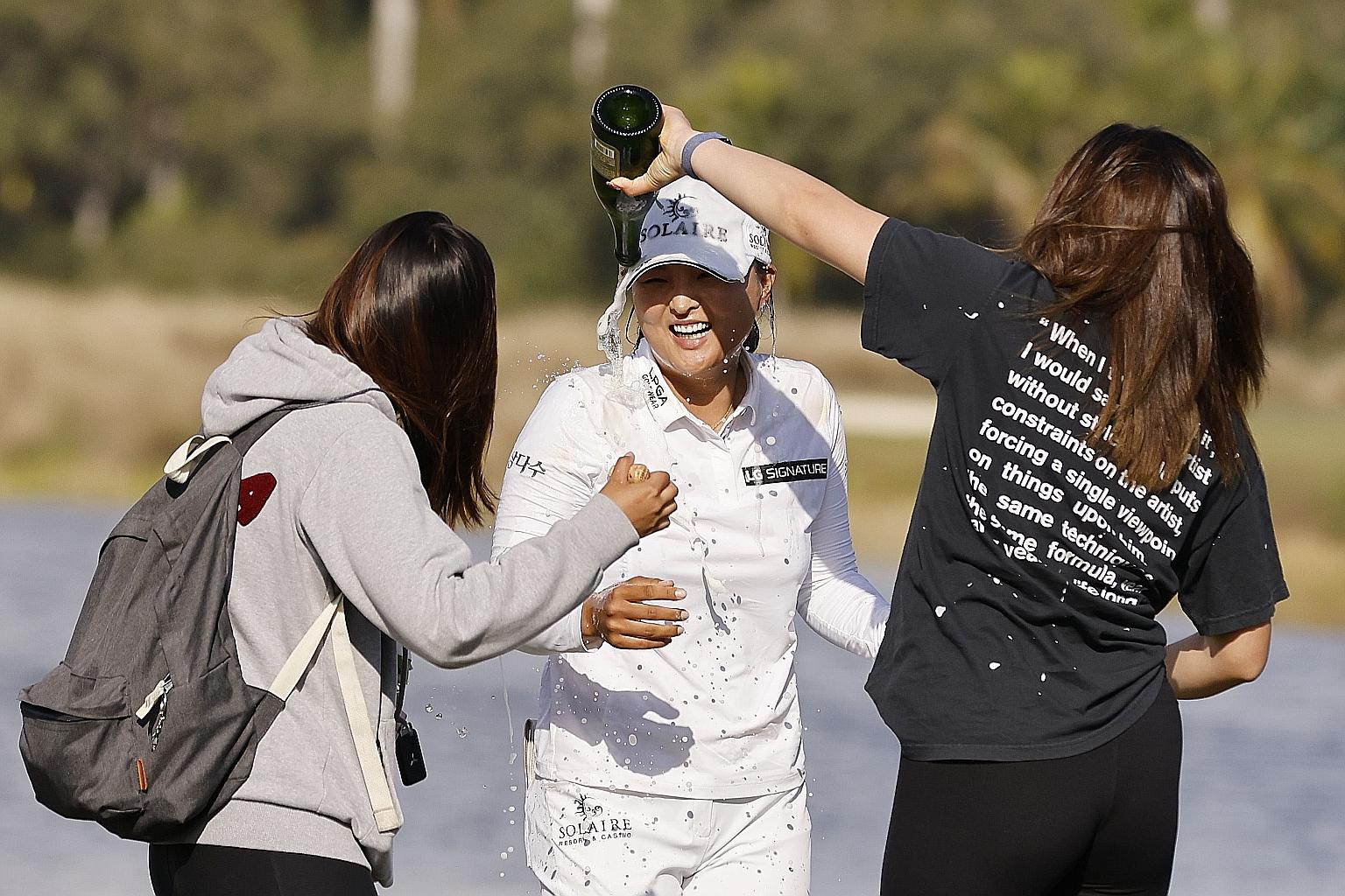 South Korean Ko Jin-young getting showered with champagne on the 18th green after winning the Tour Championship at Tiburon Golf Club on Sunday in Naples, Florida.