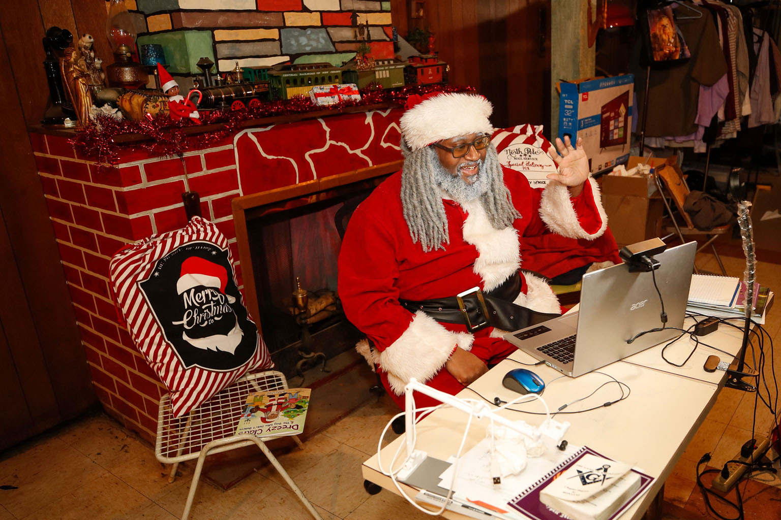 Mr Andre Russel, dressed as Santa Claus, chatting with a child during a virtual meeting in the basement of his home in Chicago, Illinois, last Thursday. PHOTO: AGENCE FRANCE-PRESSE