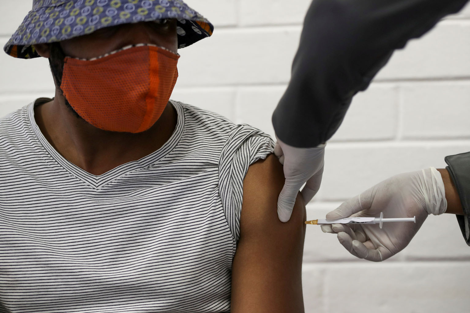 A volunteer receiving an injection in June during South Africa's first human clinical trial for a potential Covid-19 vaccine. A similar version of a highly contagious new variant of the coronavirus found circulating in Britain has emerged in South Af