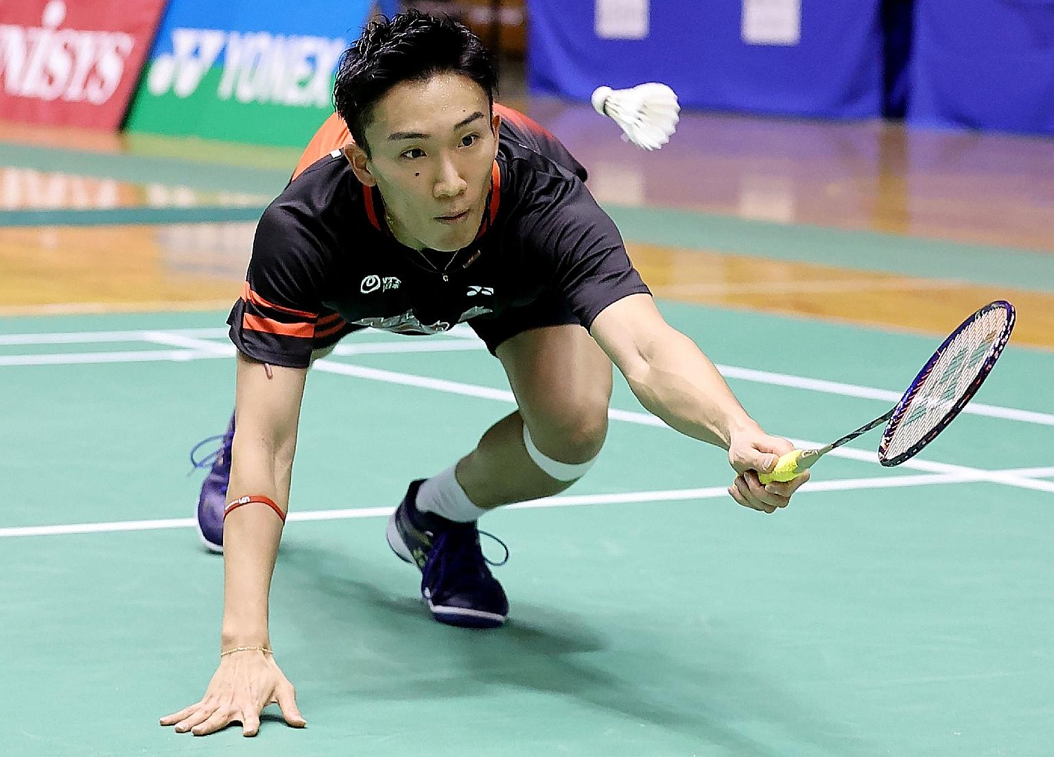 World No. 1 Kento Momota stretching for a return in the first round of the All-Japan championships yesterday, nearly a year after suffering serious injuries in a car crash. His rustiness showed in a slew of mistakes but he got through comfortably.