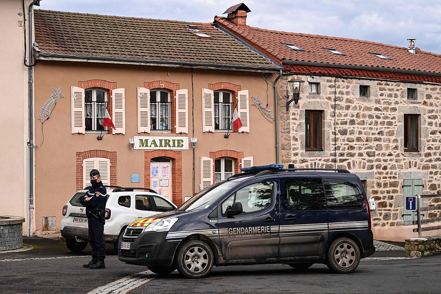 A policeman in Saint-Just yesterday after the shooting incident, in which three officers were killed and a fourth was wounded.
