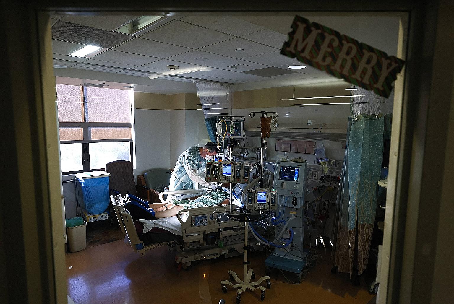 A doctor attending to a Covid-19 patient in the intensive care unit (ICU) at Sharp Chula Vista Medical Centre in California on Monday. The state is an epicentre of the latest surge in US cases, and ICU beds are scarce with hospitals also saying they