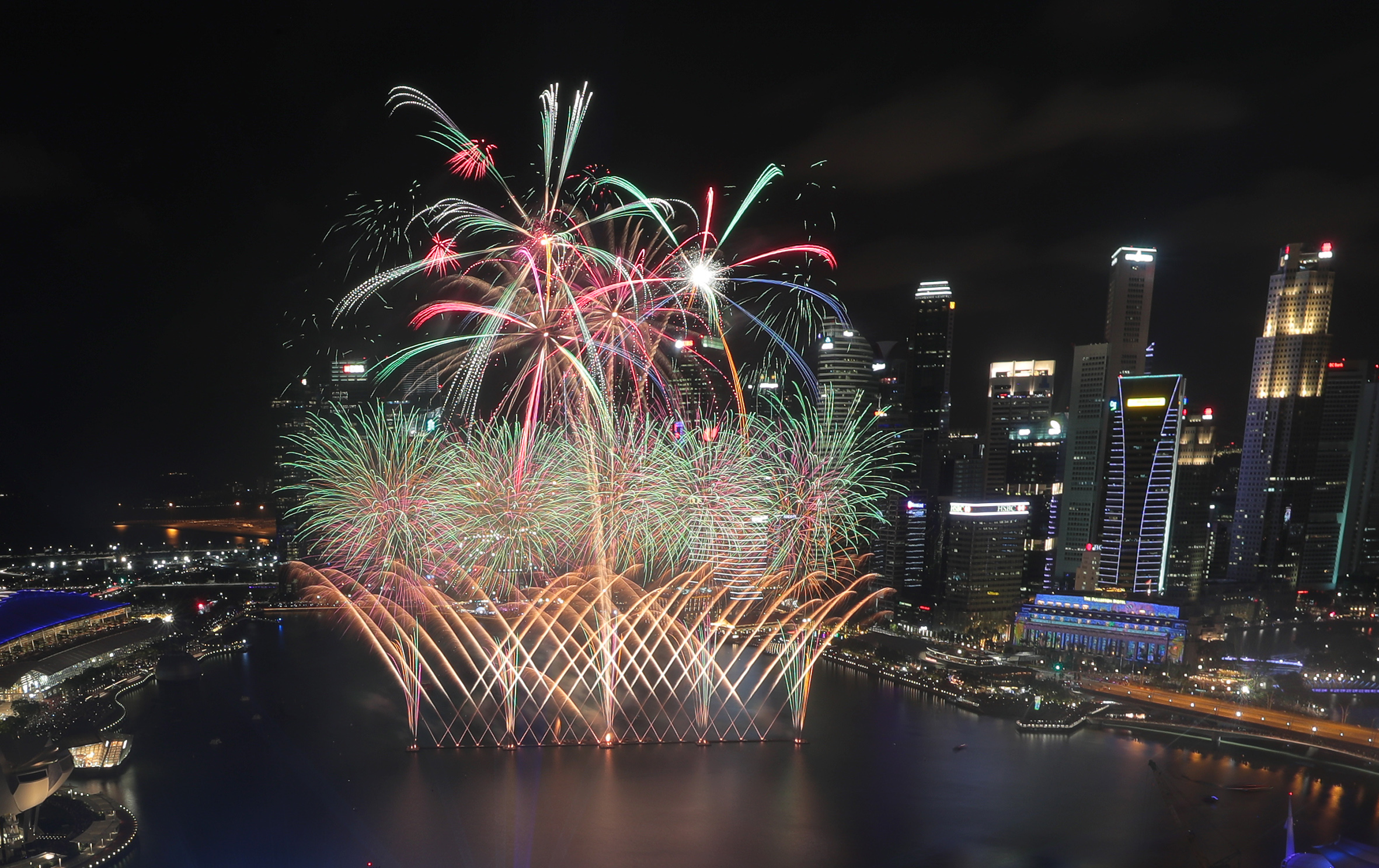 Fireworks lighting up the city skyline during the Marina Bay New Year's Eve countdown last year. There will be no such display at Marina Bay this year, but they will dazzle the skies in HDB towns like Bishan and Bedok instead. Residents are encourage