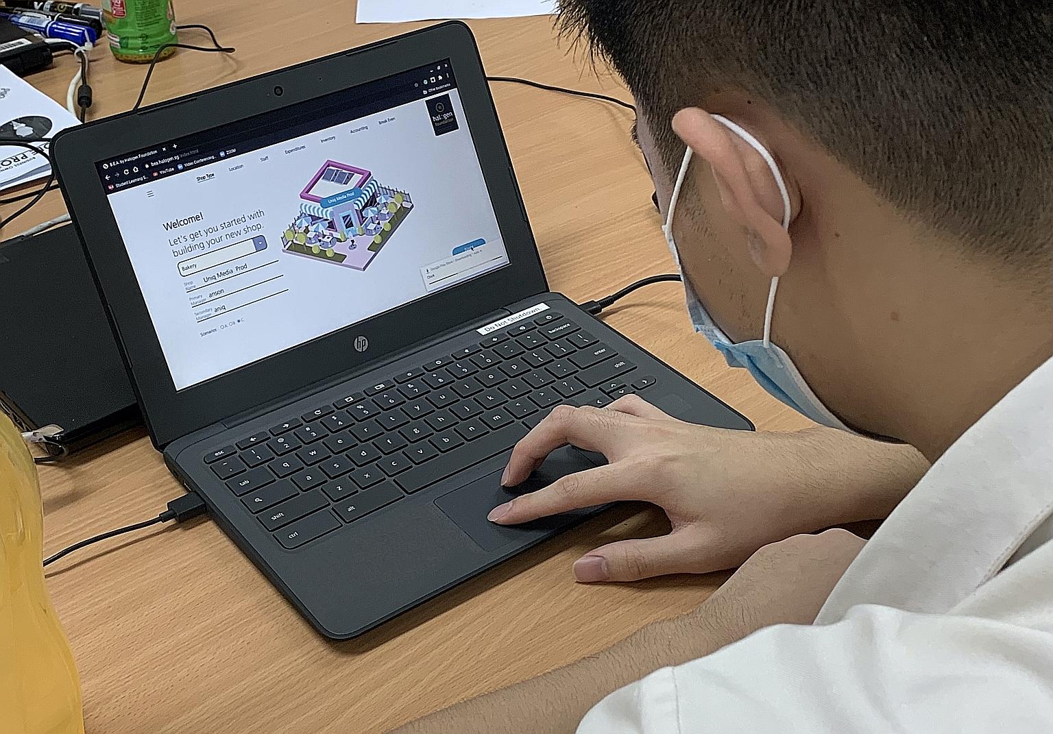 A Secondary 3 student using a Web app focusing on business concepts such as expenditure and revenue. The app, which was developed by volunteers from investment bank UBS Singapore, is used by students in a Halogen Foundation programme that helps parti