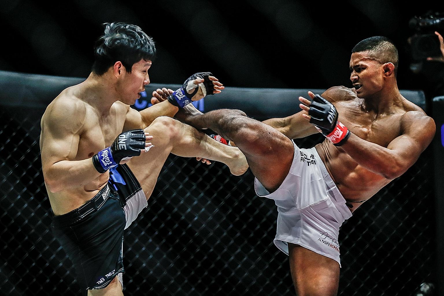 Amir Khan aiming a kick at South Korean Park Dae-sung on Dec 18. The Singaporean lost via split decision in his three-round lightweight bout at One Championship's Collision Course II event, which was broadcast on Xmas night. Two judges gave Park the 