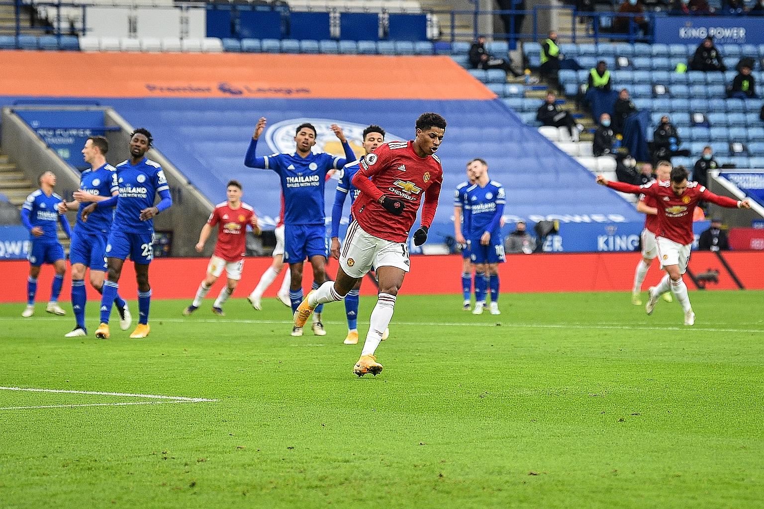 Manchester United's Marcus Rashford wheels away after opening the scoring in their Premier League match against hosts Leicester City yesterday. The game ended in a 2-2 draw.