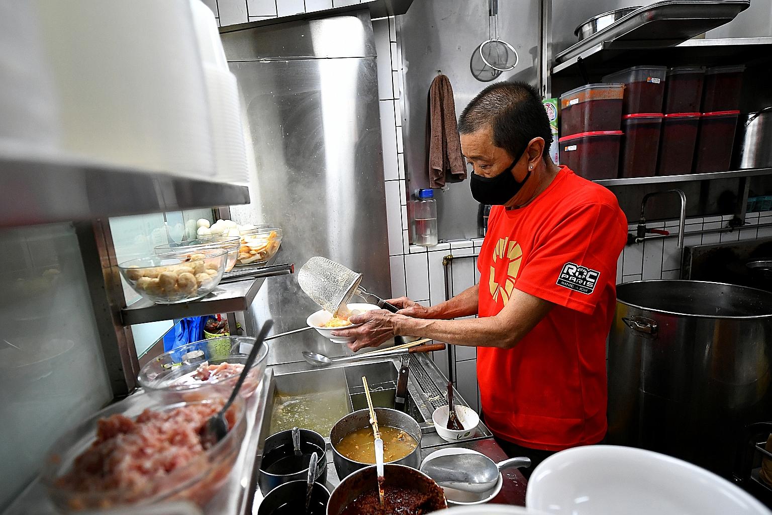 Hawker Goh Peng Huat preparing fishball noodles. He and his wife Chia Gek Kee run the Nam Kee Teochew 70's Heritage Katong stall, which has been around since 1976. The couple are keen to join the hawker succession scheme as their daughters are not in