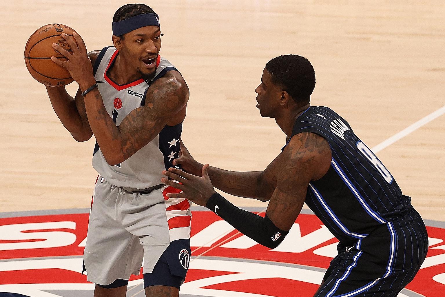 Wizards guard Bradley Beal trying to get past Magic guard Dwayne Bacon during their NBA game in Washington DC on Boxing Day. The Wizards have started the season 0-2 and need to improve in defence and free-throw shooting.