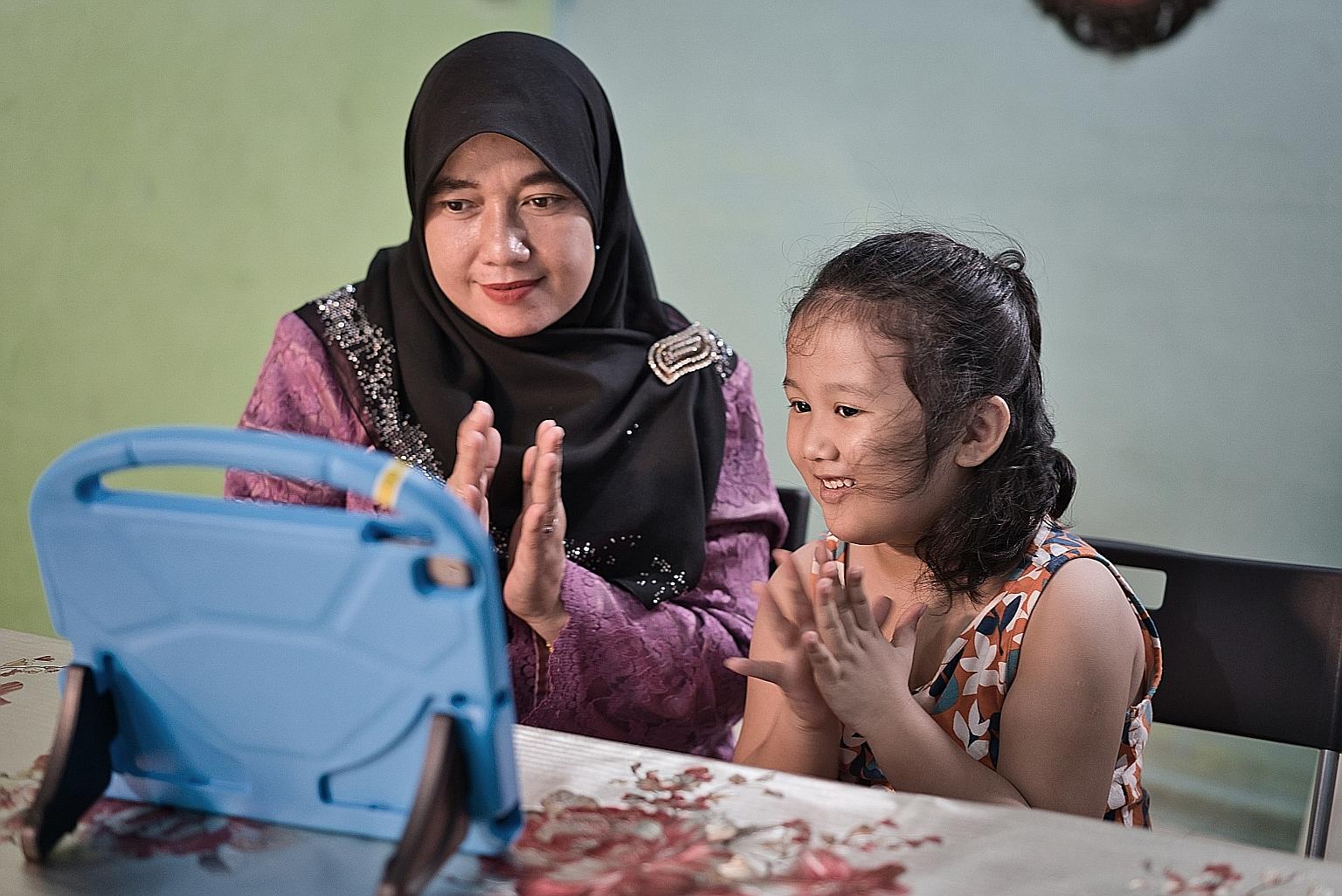 Madam Susilawati Thamrin and her five-year-old daughter Alesha Nur Shareefa Haminorrashid, who attends an NTUC First Campus' My First Skool centre in Toa Payoh, will benefit from the Digital Kampung Programme next year. The initiative is fully suppor