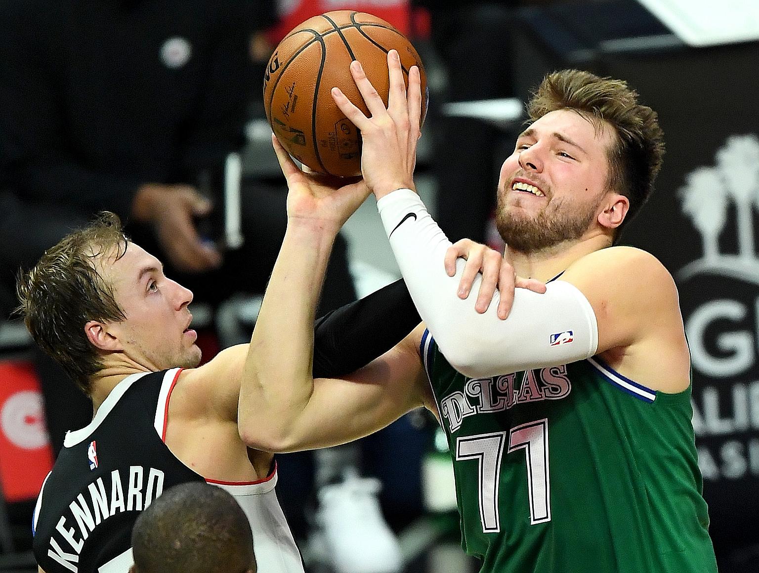Dallas' Luka Doncic is fouled by the Los Angeles Clippers' Luke Kennard. The Mavericks, who gave the Clippers a scare in the first round of last season's play-offs, scored more points in the first half than their opponents did the entire game.