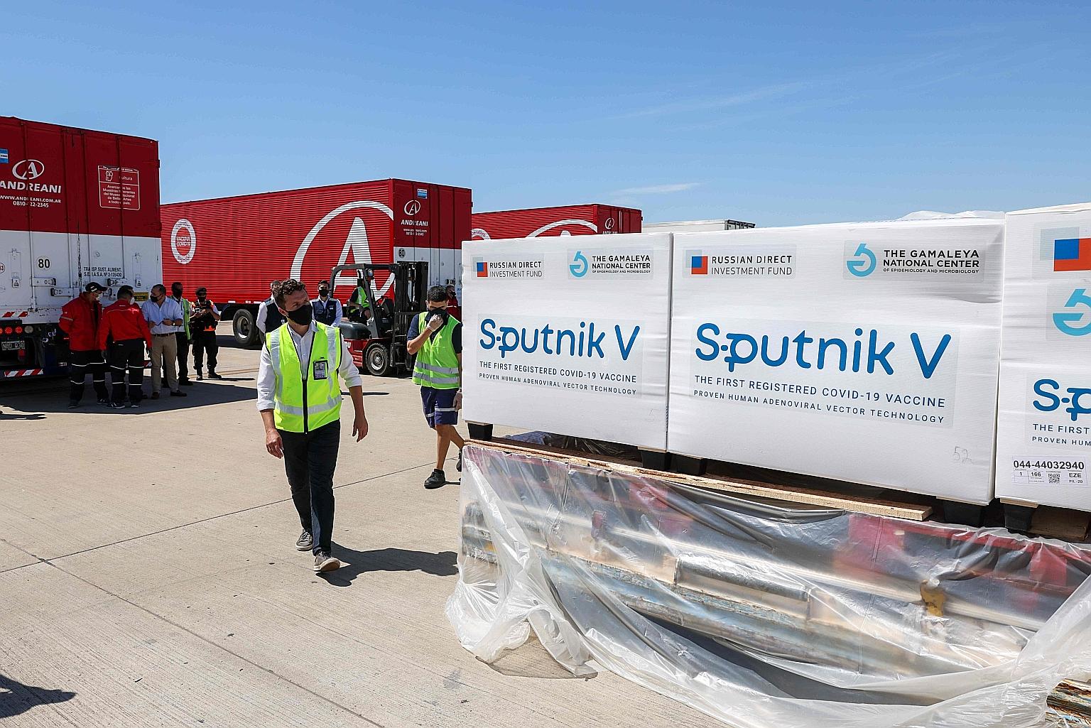 Shipping containers with 300,000 doses of Russia's Sputnik V vaccine at Ezeiza International Airport in Buenos Aires on Dec 24. The shipment is part of a 10-million-dose deal with Argentina.