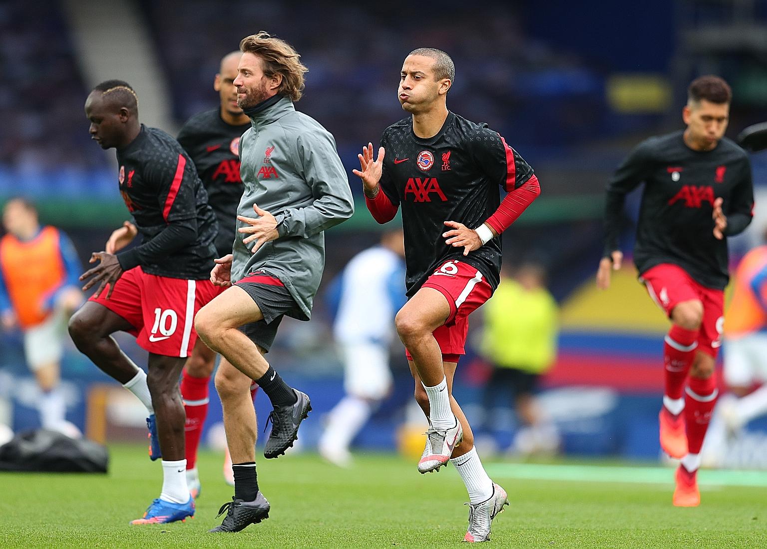 Thiago Alcantara (centre) has returned to training with Liverpool following injury, but the Newcastle trip today will come to early for him.