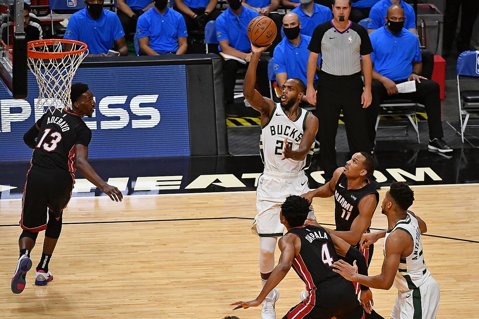 Milwaukee Bucks' Khris Middleton making an easy basket during their 144-97 hammering of the Miami Heat. The forward sank 10 of 13 field goals for a game-high 25 points.