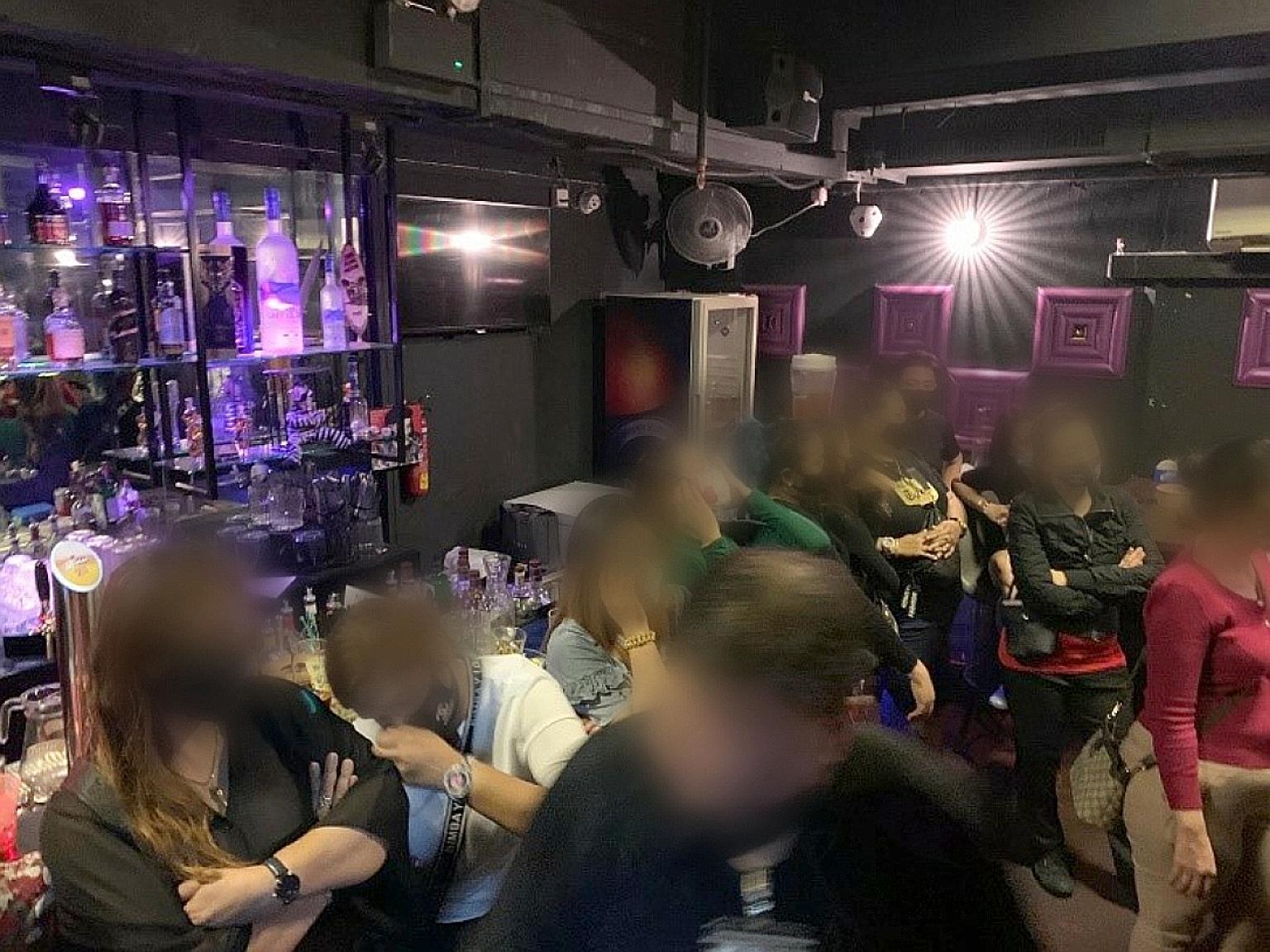 Large groups of patrons were found to be crowding together and consuming alcohol just after midnight at MZS Family Karaoke - which was open as an F&B outlet - in Cuscaden Road.