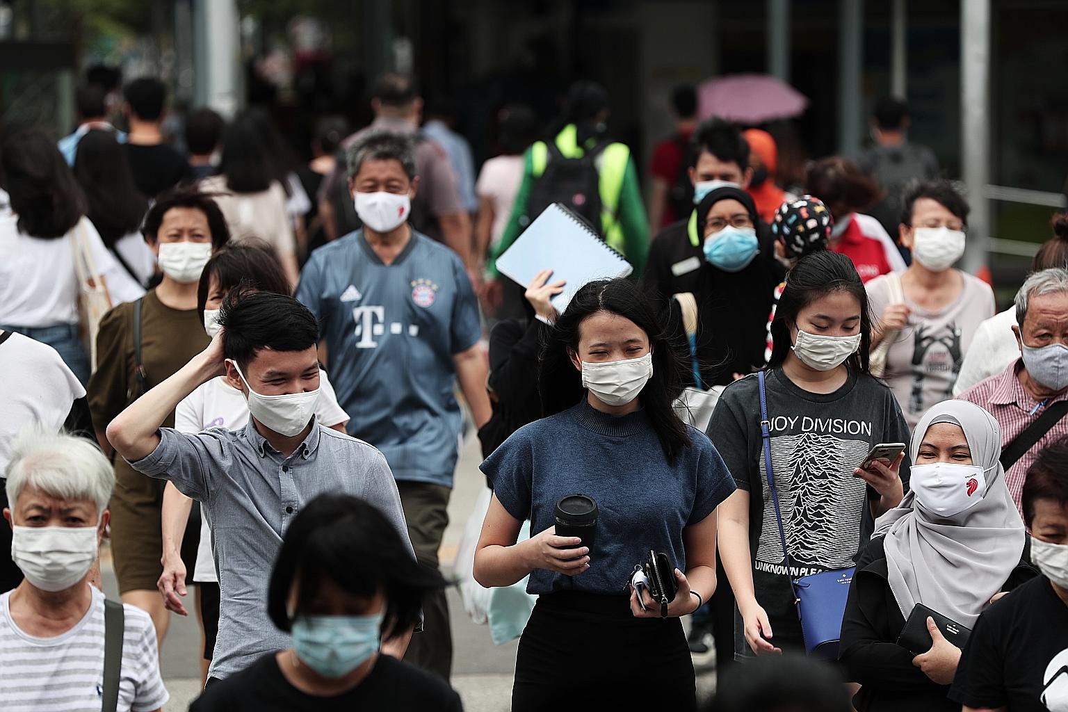 Top: A near-deserted Raffles Place during what would normally be the evening rush hour, around 6.30pm on May 28, during the circuit breaker. Above: While educated workers, especially financially and tech-savvy folk, managed to ride out the storm and 