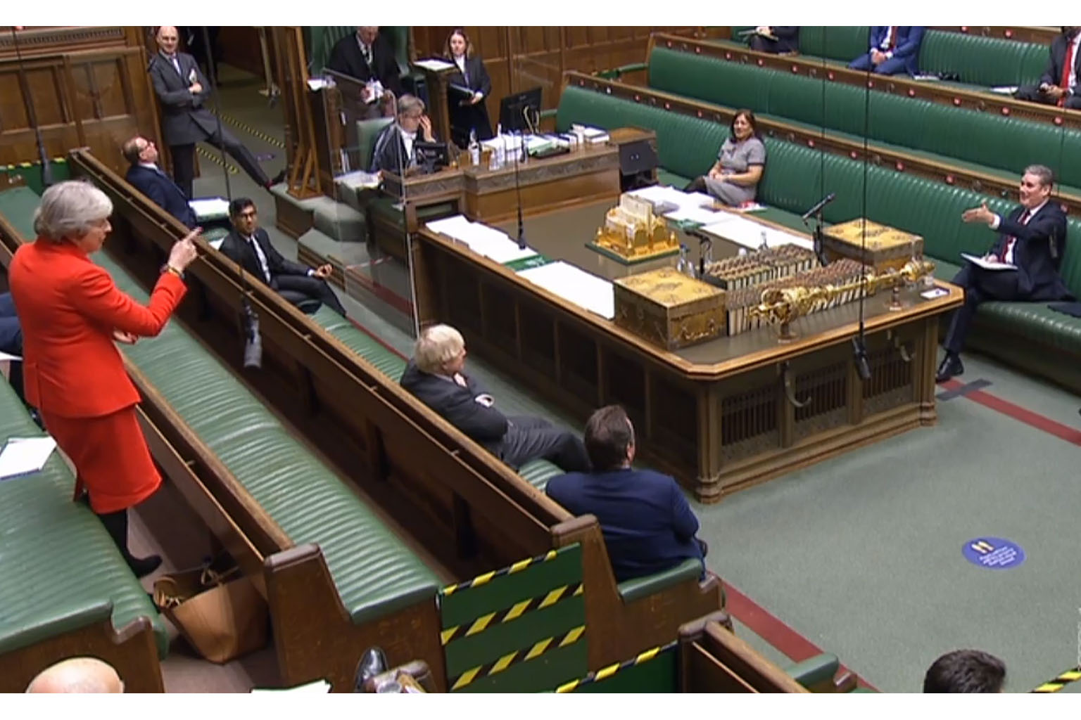 Britain's former prime minister Theresa May gesturing at Labour Party leader Keir Starmer during the debate on the EU Future Relationship Bill in the House of Commons in London yesterday. Parliament's Lower House voted 521 to 73 in favour of the Brex