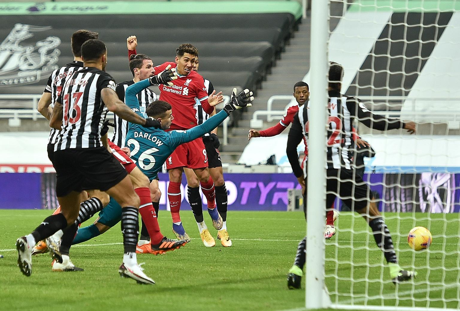 Liverpool's Roberto Firmino heading wide in the 0-0 draw with Newcastle on Wednesday. The Reds bossed possession and had 11 shots but were unusually profligate in front of goal.