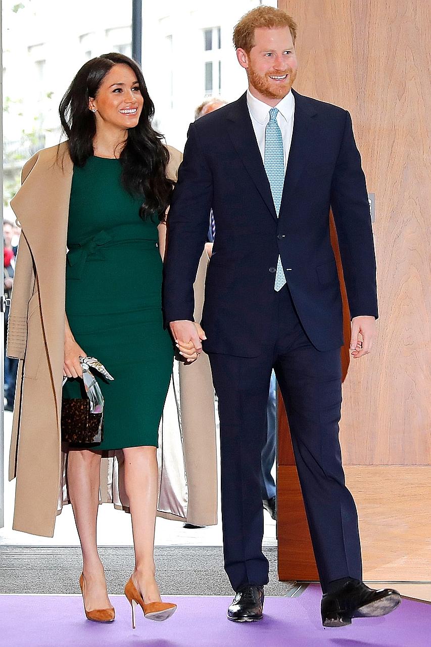 Britain's Prince Harry and his wife Meghan Markle (both left, in a 2019 file photo) thanked essential workers in their first Spotify podcast.