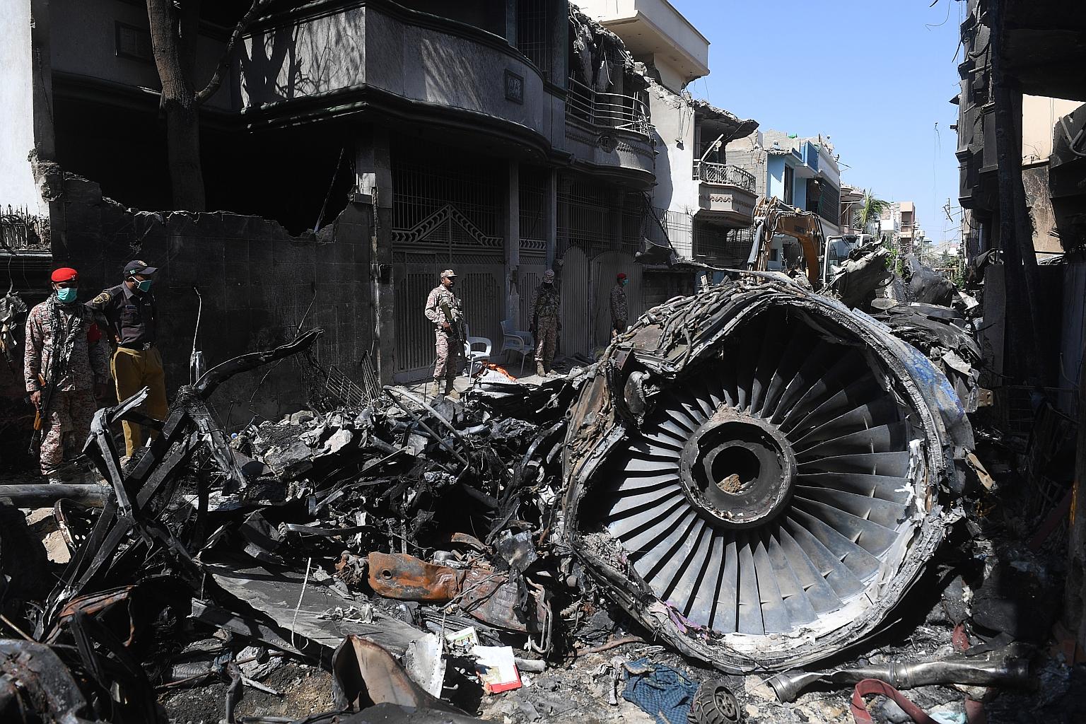 The wreckage from the crash of the Pakistani jet that killed 98 people in May, in the second deadliest airline incident last year. Worldwide, 299 people were killed in large commercial airplane crashes in the year.