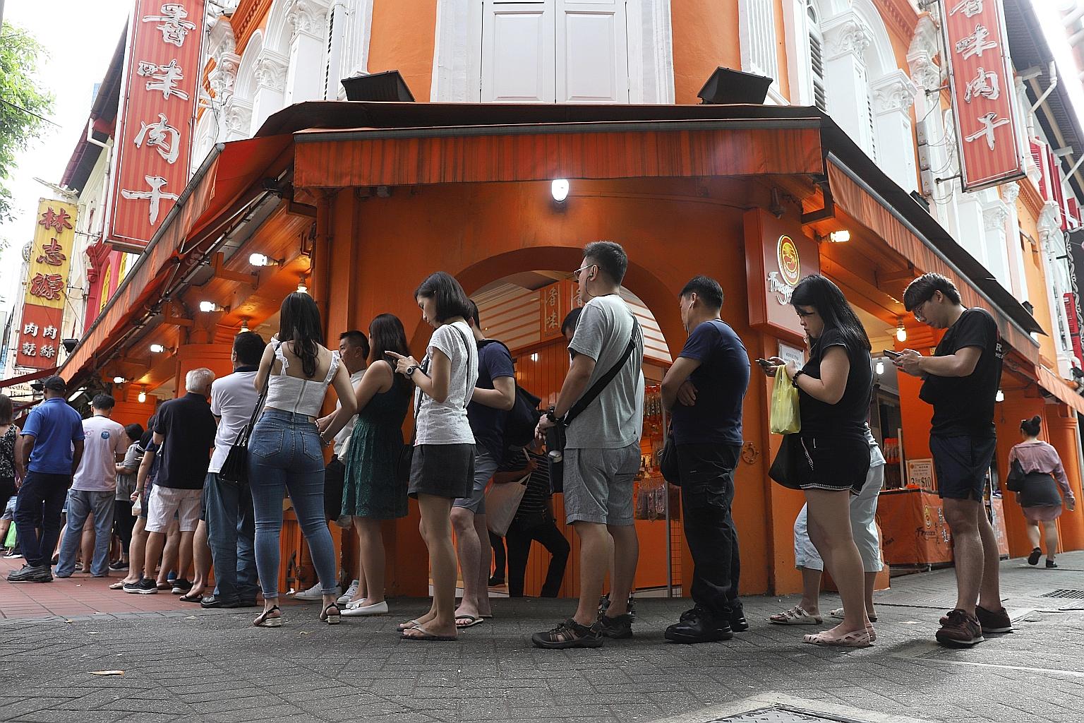 People queueing last January to buy bak kwa at Lim Chee Guan in Chinatown. This year, there will be no walk-in sales of barbecued items at Lim Chee Guan outlets from Jan 20 to Feb 9. Customers can place orders on its website now for items to be deliv