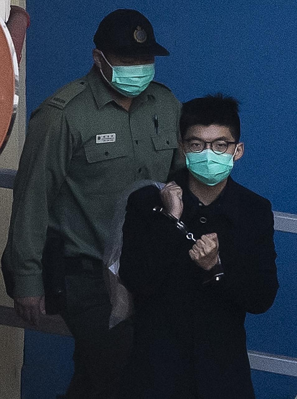 Joshua Wong, seen here earlier last month on his way to court, has been repeatedly detained for his role in organising pro-democracy rallies. PHOTO: AGENCE FRANCE-PRESSE