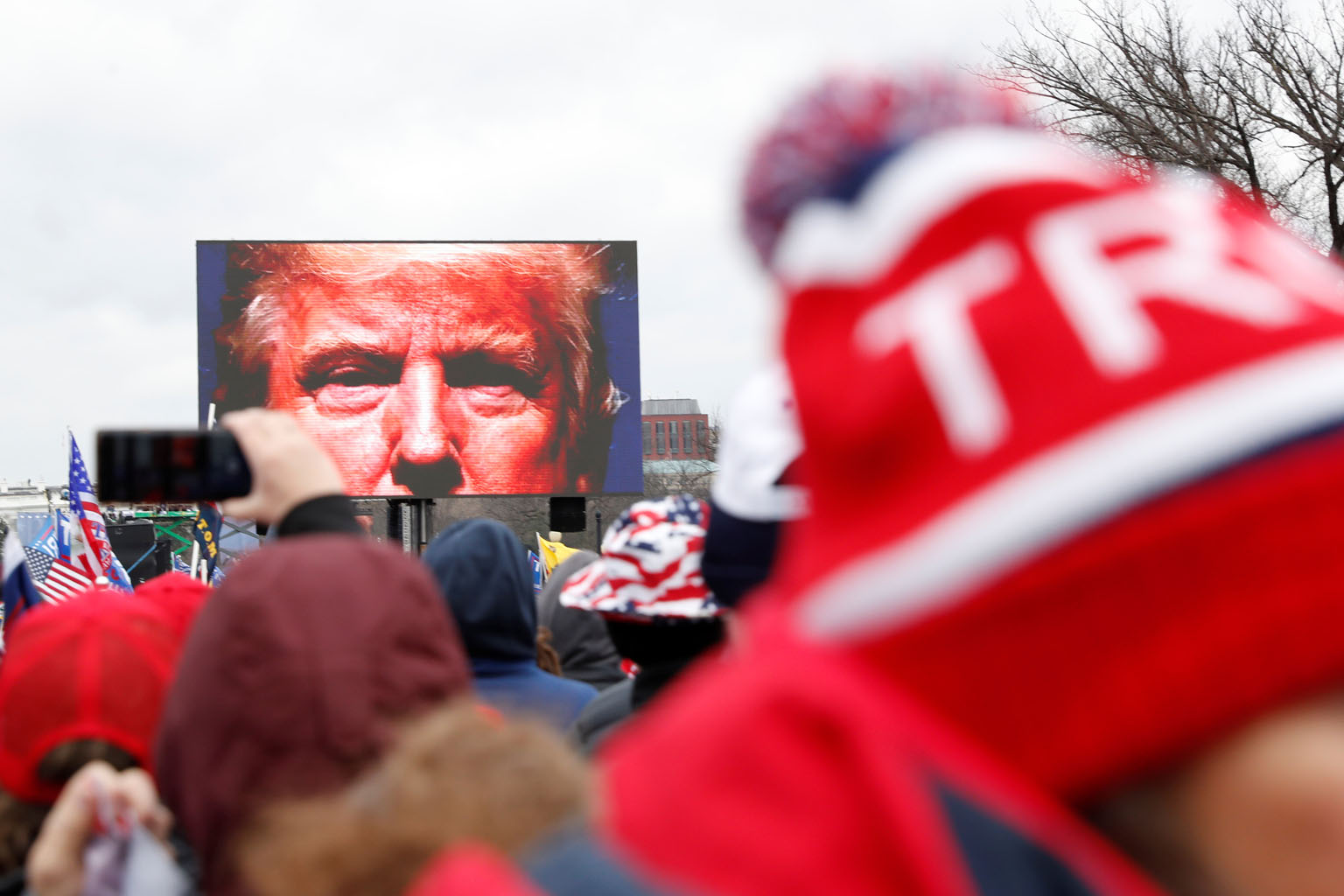 US President Donald Trump speaking to supporters on a screen during a rally in Washington last Wednesday. House Speaker Nancy Pelosi said in a statement on Friday that if Mr Trump does not ''immediately resign'', the House will move forward with a motion