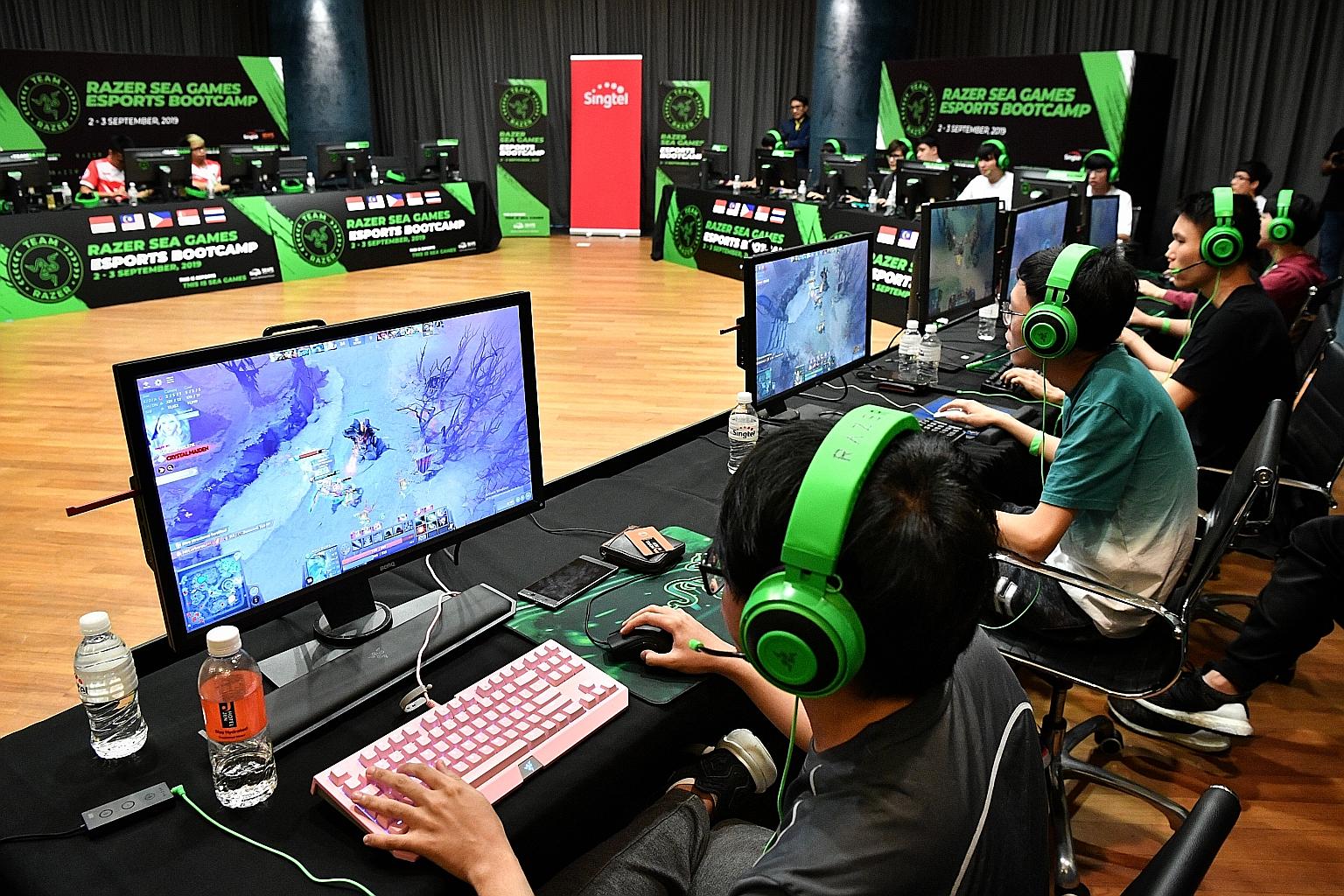 The Singapore team training at a boot camp before the 2019 SEA Games, where e-sports made its debut as a medal event. The Republic won a silver and a bronze. ST PHOTO: CHONG JUN LIANG