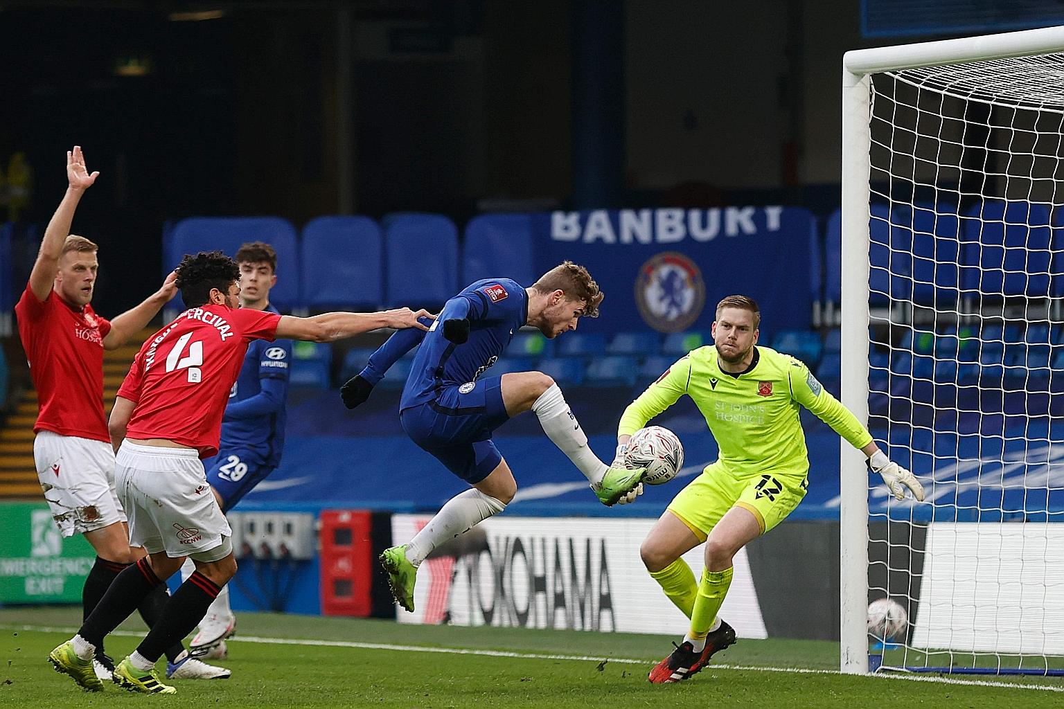 Timo Werner bundling home Chelsea's second goal against League Two side Morecambe as the Blues strolled to a 4-0 win in the FA Cup. The German ended a run of 827 minutes without scoring. PHOTO: AGENCE FRANCE-PRESSE