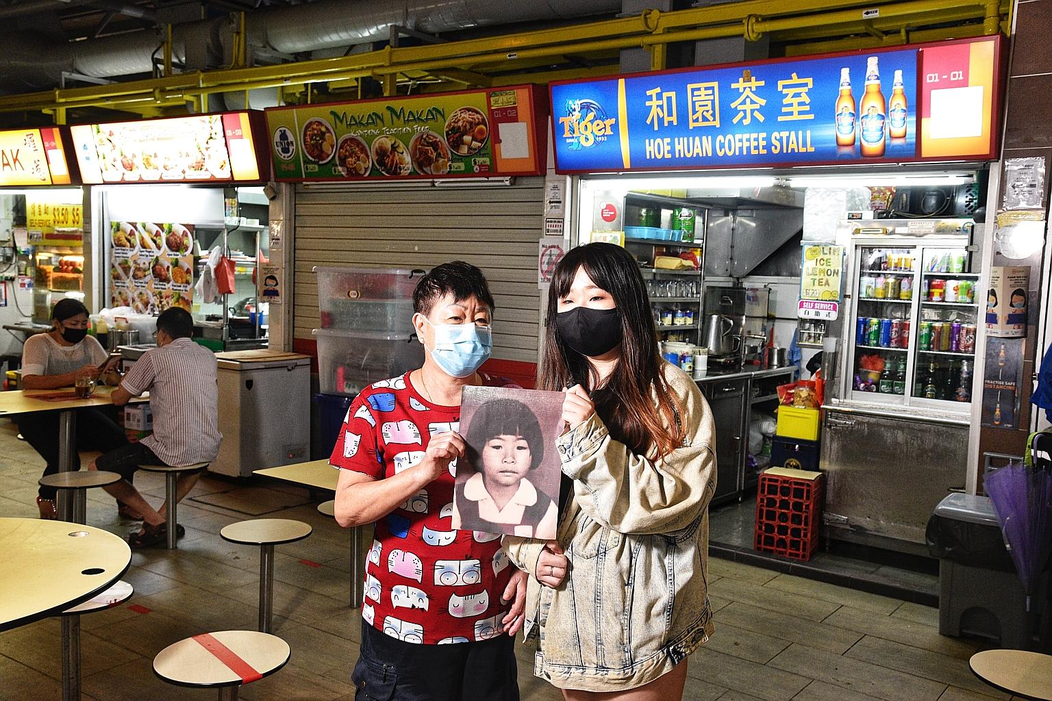 Madam Ang Goon Lay, 65, with her daughter, Lim Jia Hui, 27, holding a picture of then seven-year-old Lim Shiow Rong who was raped and killed in 1995. The murderer was never caught. The pupil was last seen at the coffee shop where her mother worked at