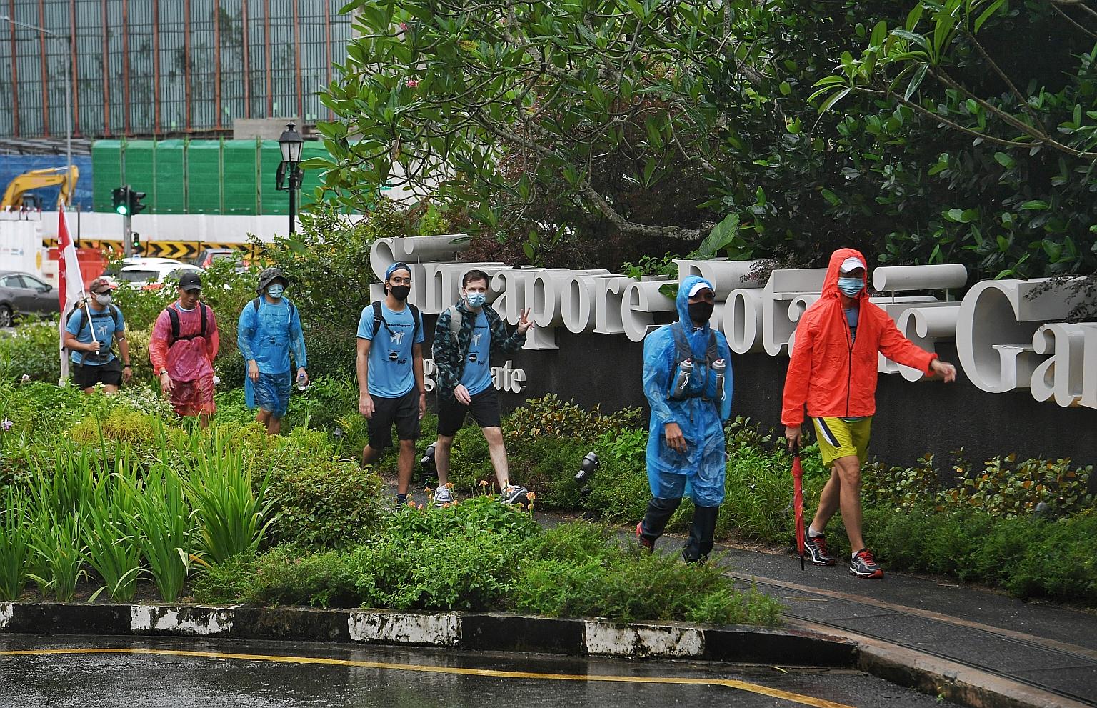 Participants of the finale of charity walk Ruck-On! Singapore! braved yesterday's downpour to walk across the country's central district. It was the last of five "rucking" events that took place over the past month, attracting about 380 participants 