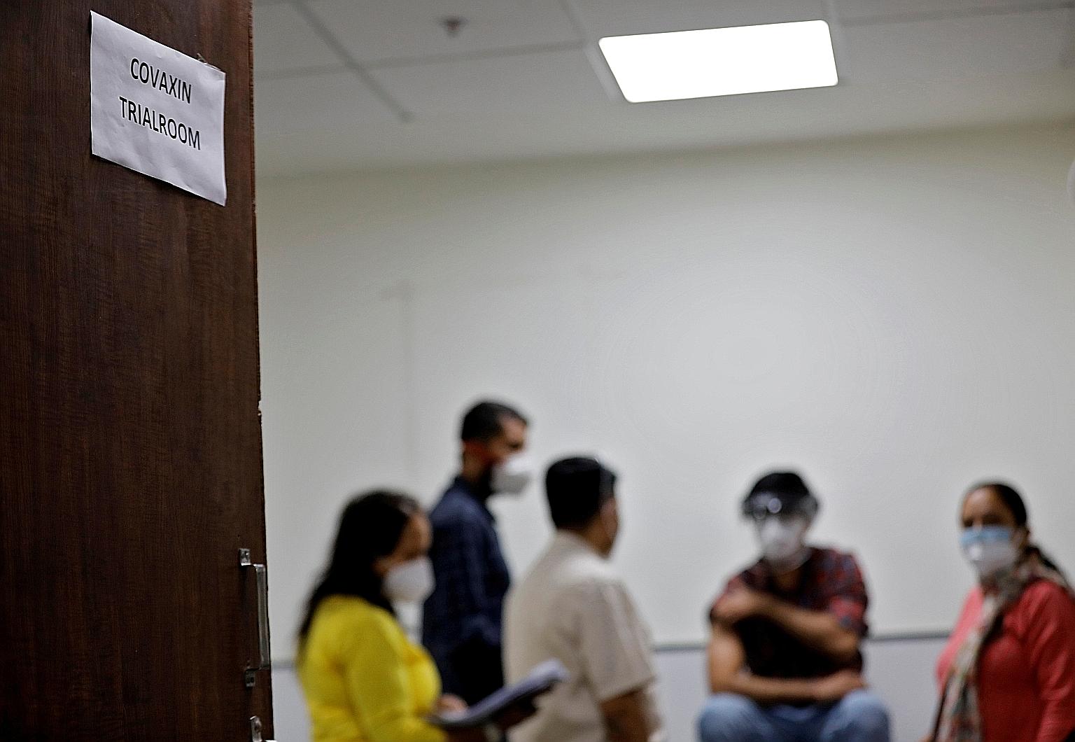 A health worker preparing to receive a Covaxin shot as part of a trial at the Gujarat Medical Education and Research Society in Ahmedabad, India, last November. Covaxin, a shot developed by India's Bharat Biotech International, has been approved for