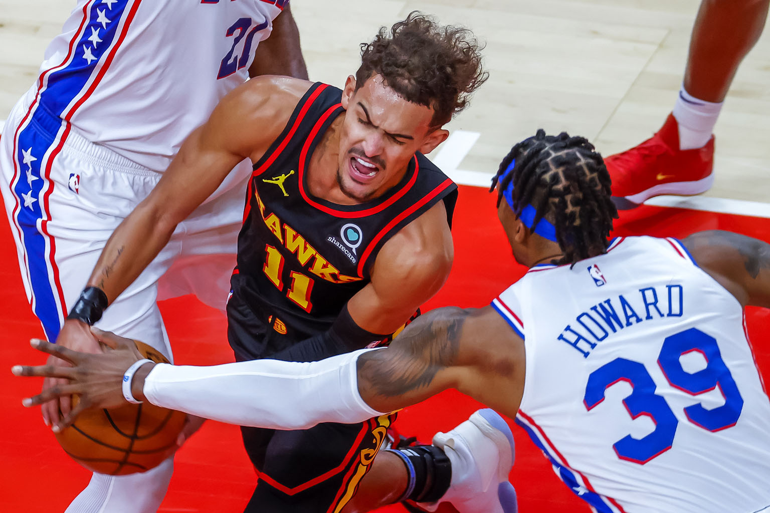 Atlanta Hawks' Trae Young trying to barge through the Philadelphia 76ers defence during their NBA game on Monday. He scored a game-high 26 points in the 112-94 win.