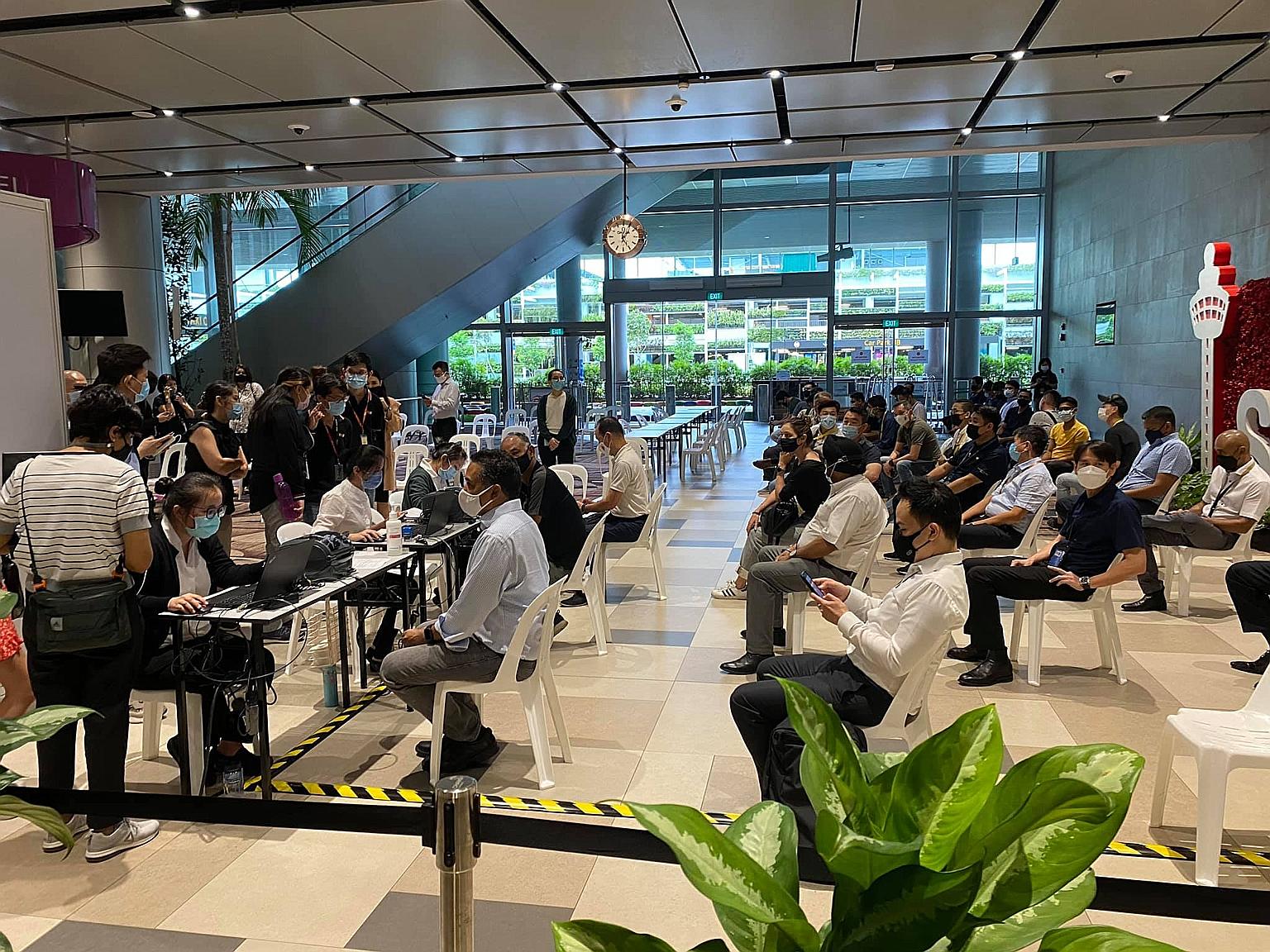 The first group of front-line airport workers getting their Covid-19 vaccine injections at Changi Airport Terminal 4 yesterday.