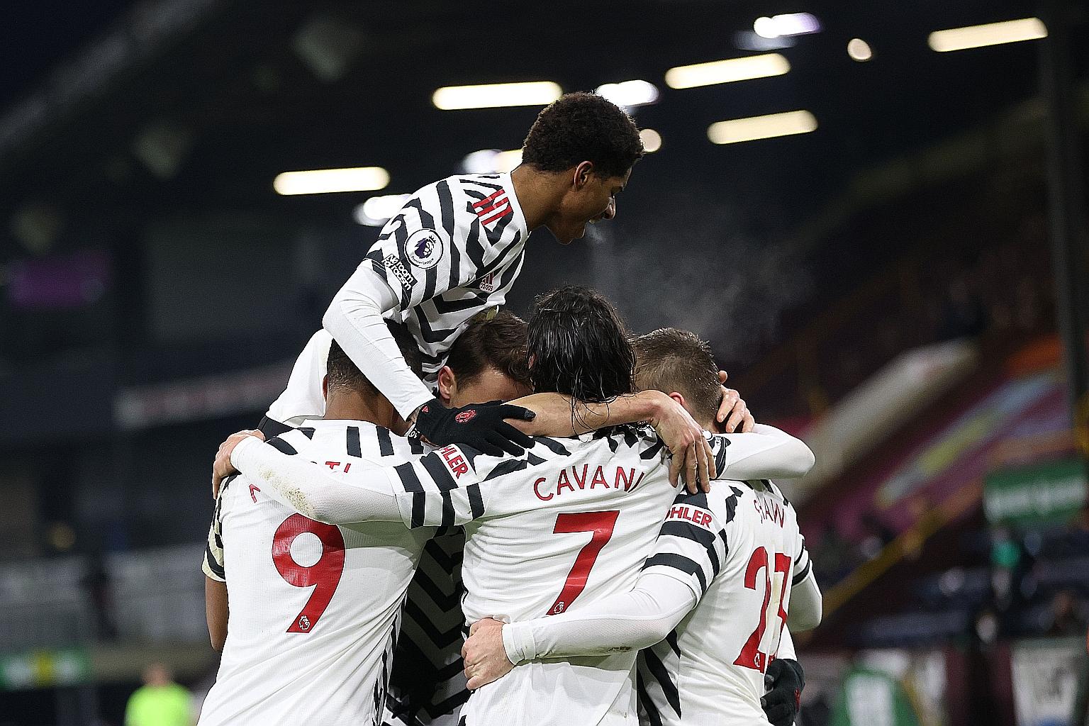 United midfielder Paul Pogba being mobbed by teammates after scoring the winner in Tuesday's league match at Burnley.