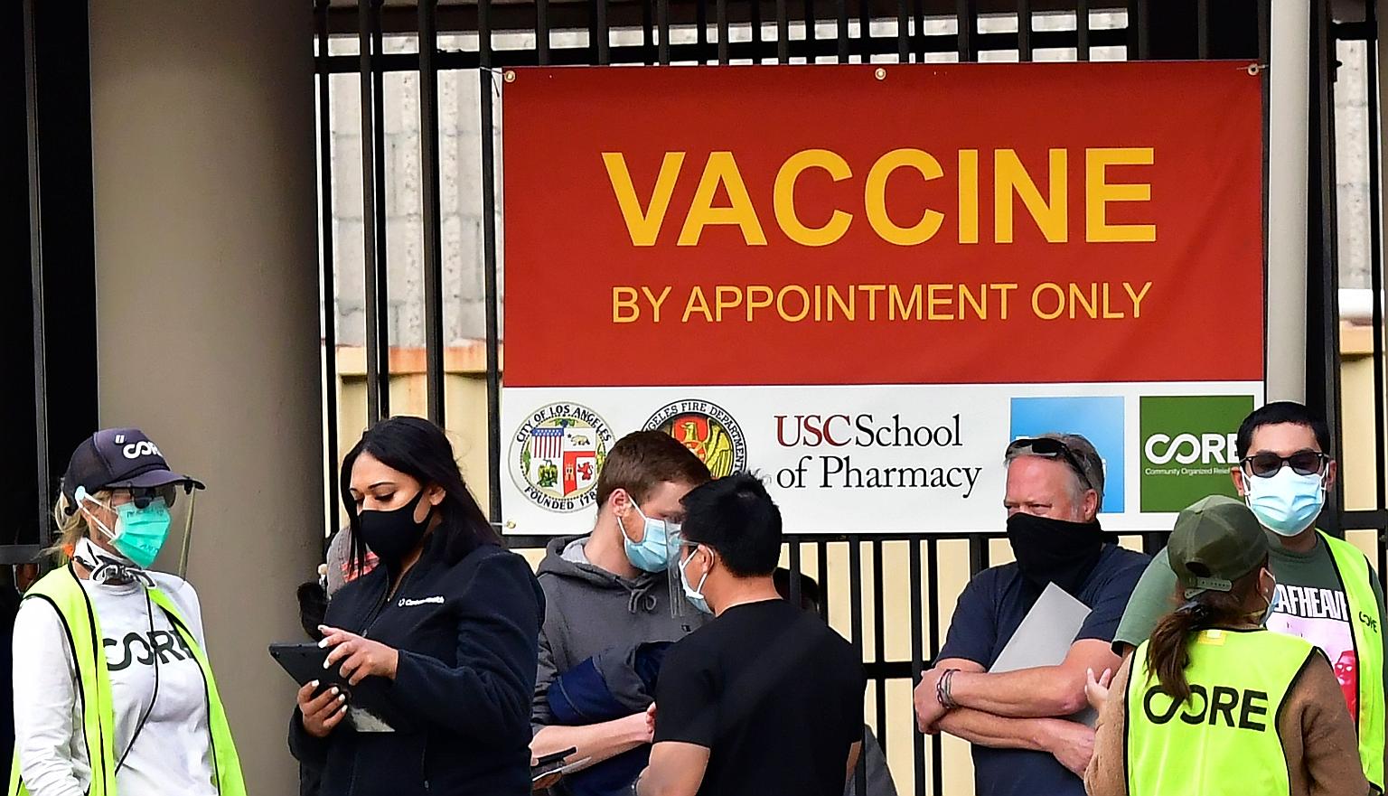 People queueing up outside a Covid-19 vaccination facility in Los Angeles, California, on Tuesday. As at Monday night, the United States had reported a total of 22.5 million coronavirus infections and 376,188 deaths, the most in any country. PHOTO: A