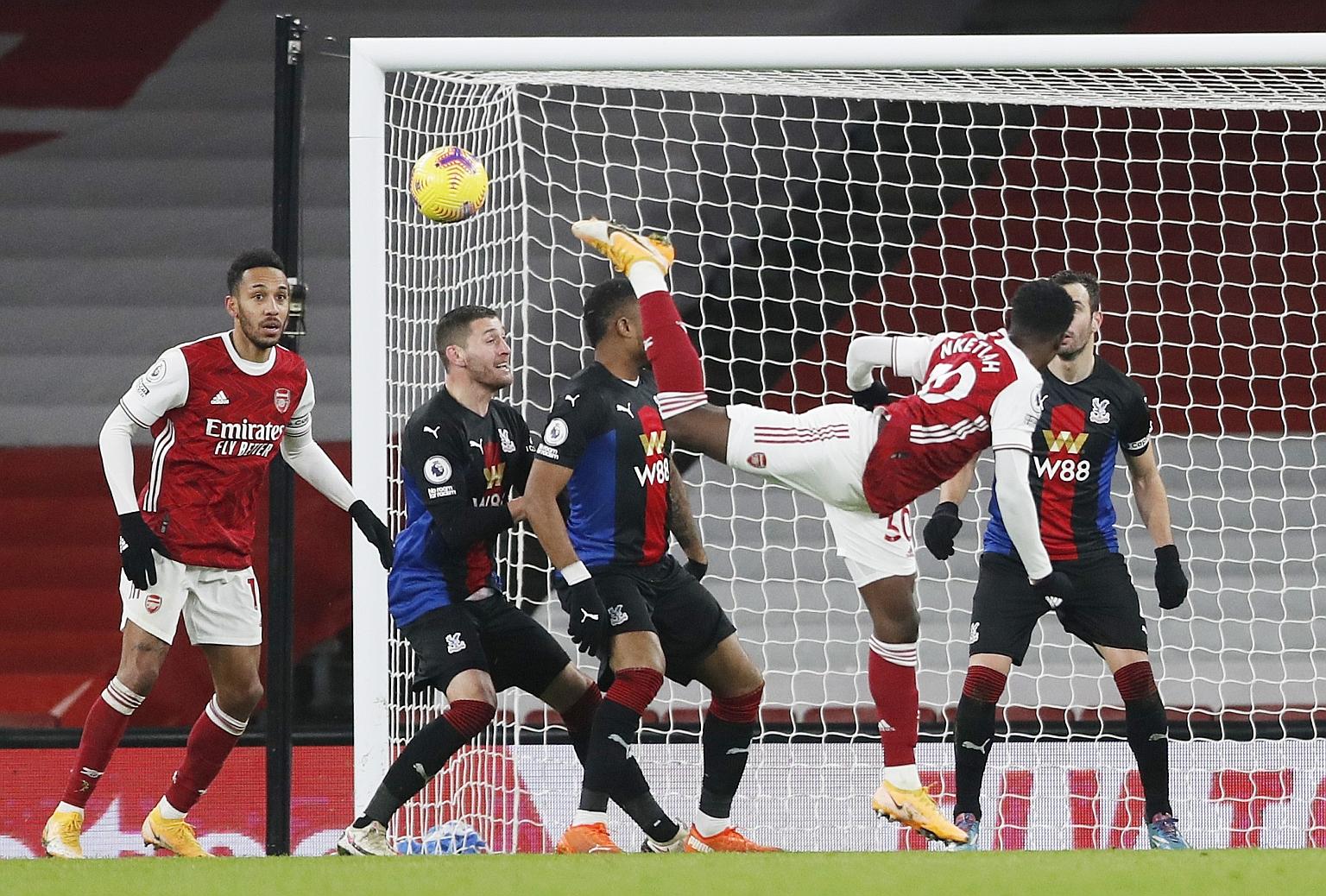 Arsenal's Eddie Nketiah trying something spectacular against Crystal Palace on Thursday. The Gunners sit in 11th place, eight points adrift of the Champions League places.