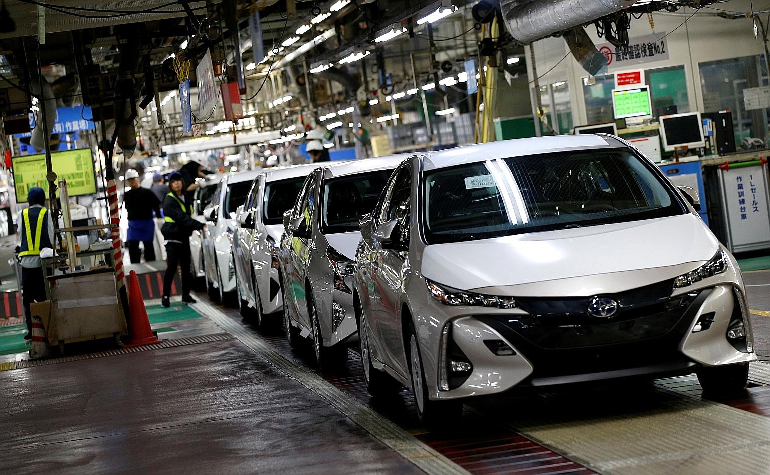 A 2017 file photo of Toyota's Prius PHV and Prius hybrid cars at the company's Tsutsumi plant in Japan. Toyota once built a reputation for clean tech on the back of these cars, but its 2019 decision to support the Trump administration's rollback of t